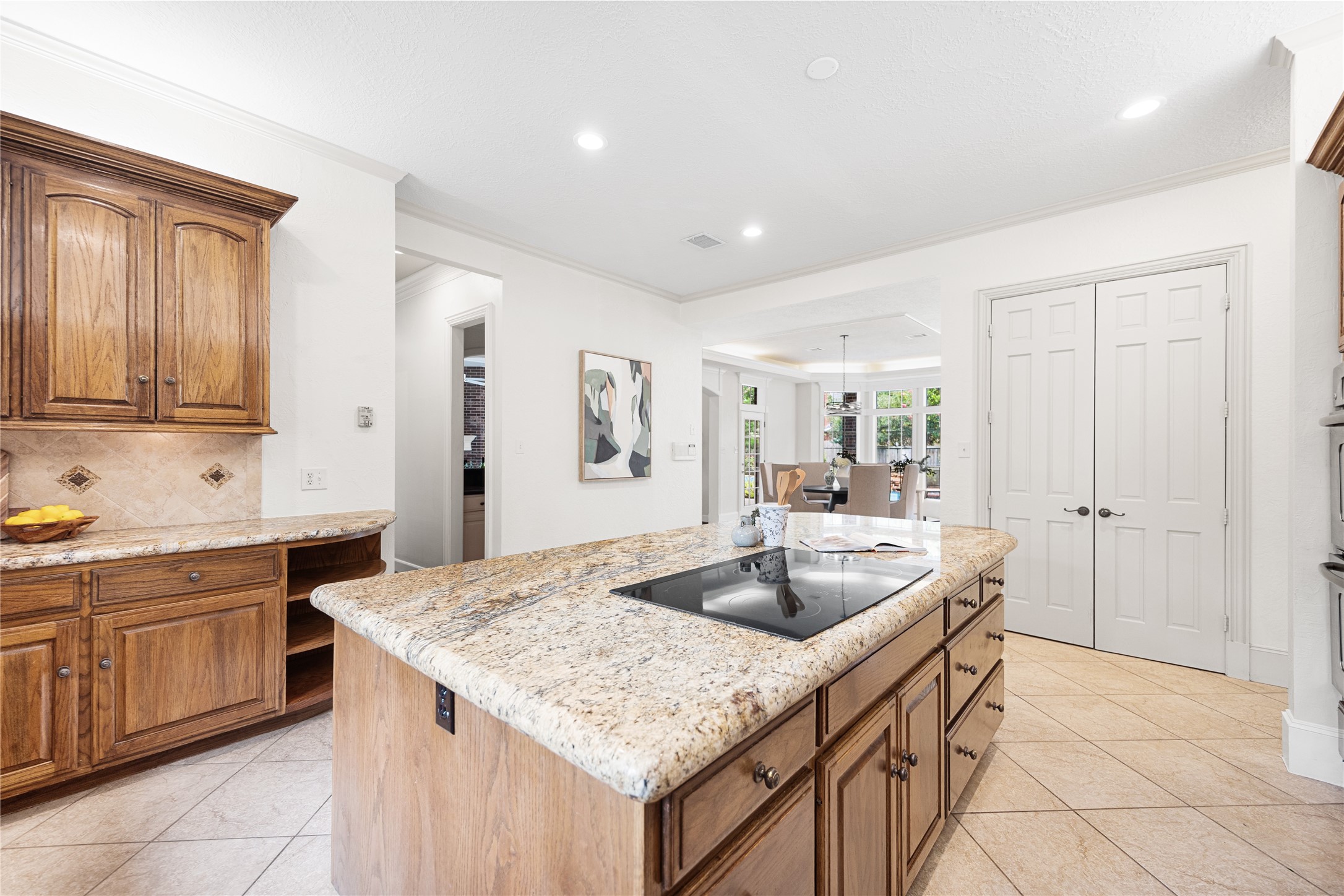 Kitchen overlooks spacious breakfast area.