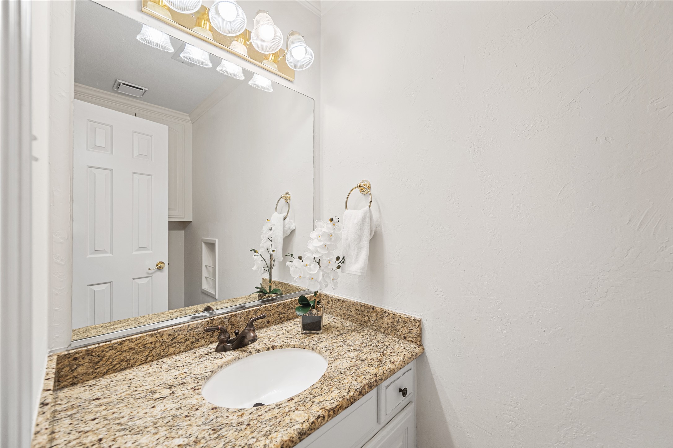 Half bath conveniently located off game room.