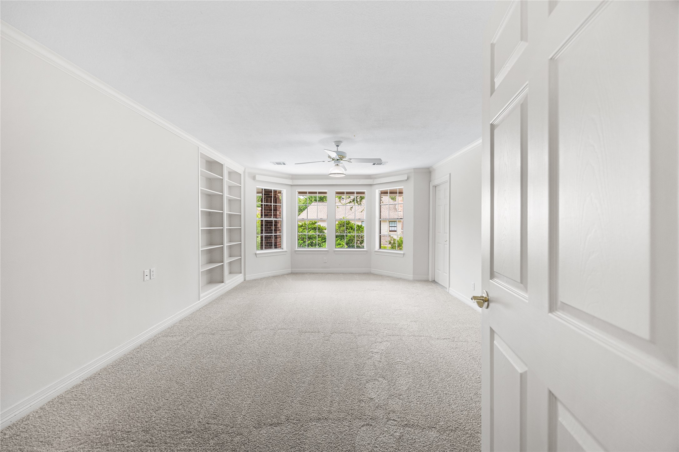 Additional secondary bedroom with generous natural light and storage.