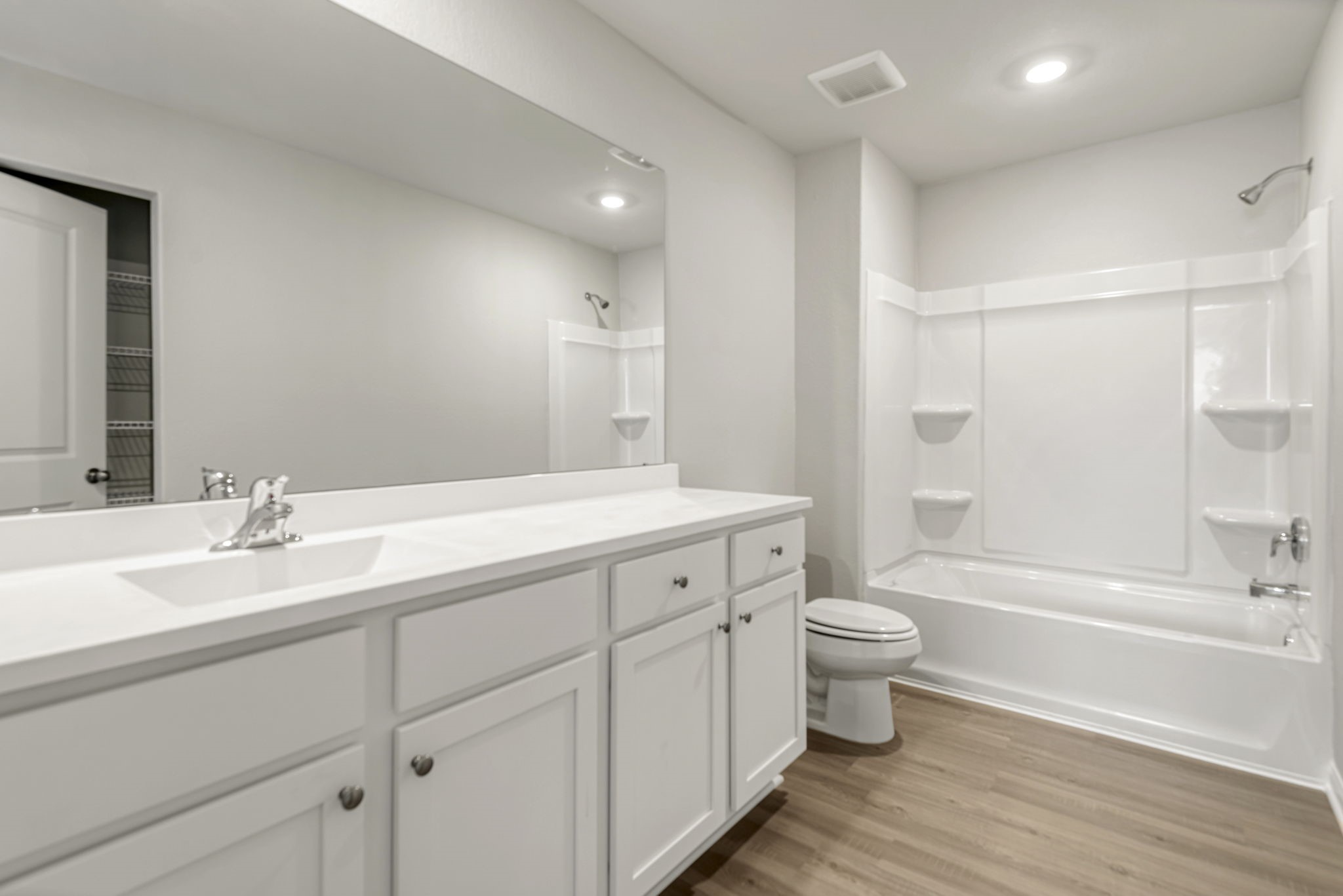 The secondary bathroom, located on the second floor of the home.
