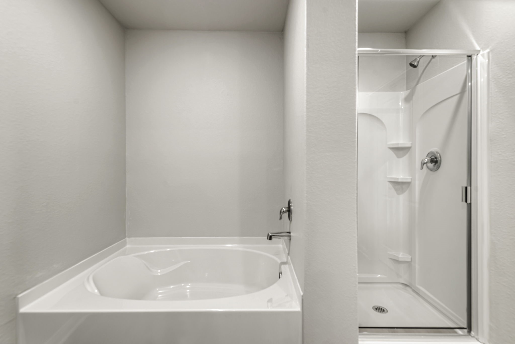 The luxurious primary bathroom has a soaking tub, standing shower, and a walk-in closet.