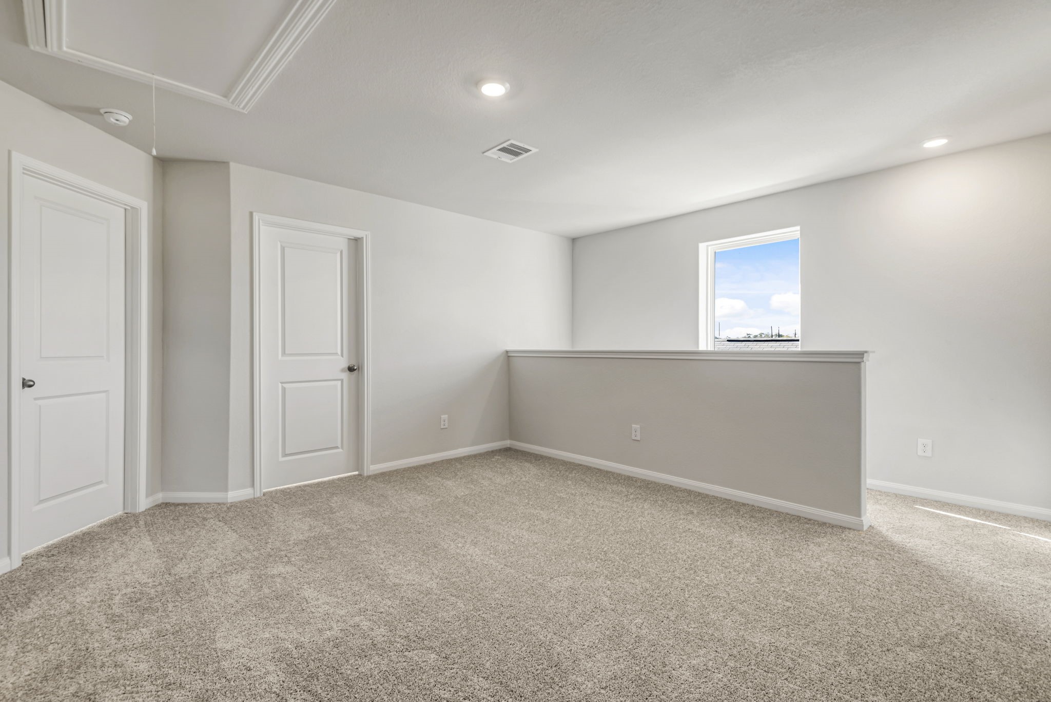 The area at the top of the stairs can be utilized for a media or game room!