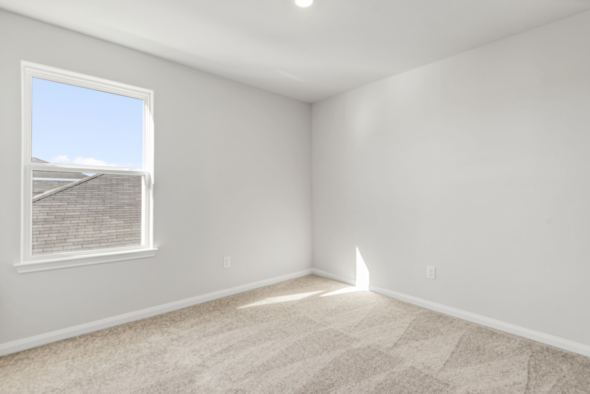 One of the three additional bedrooms in the home.