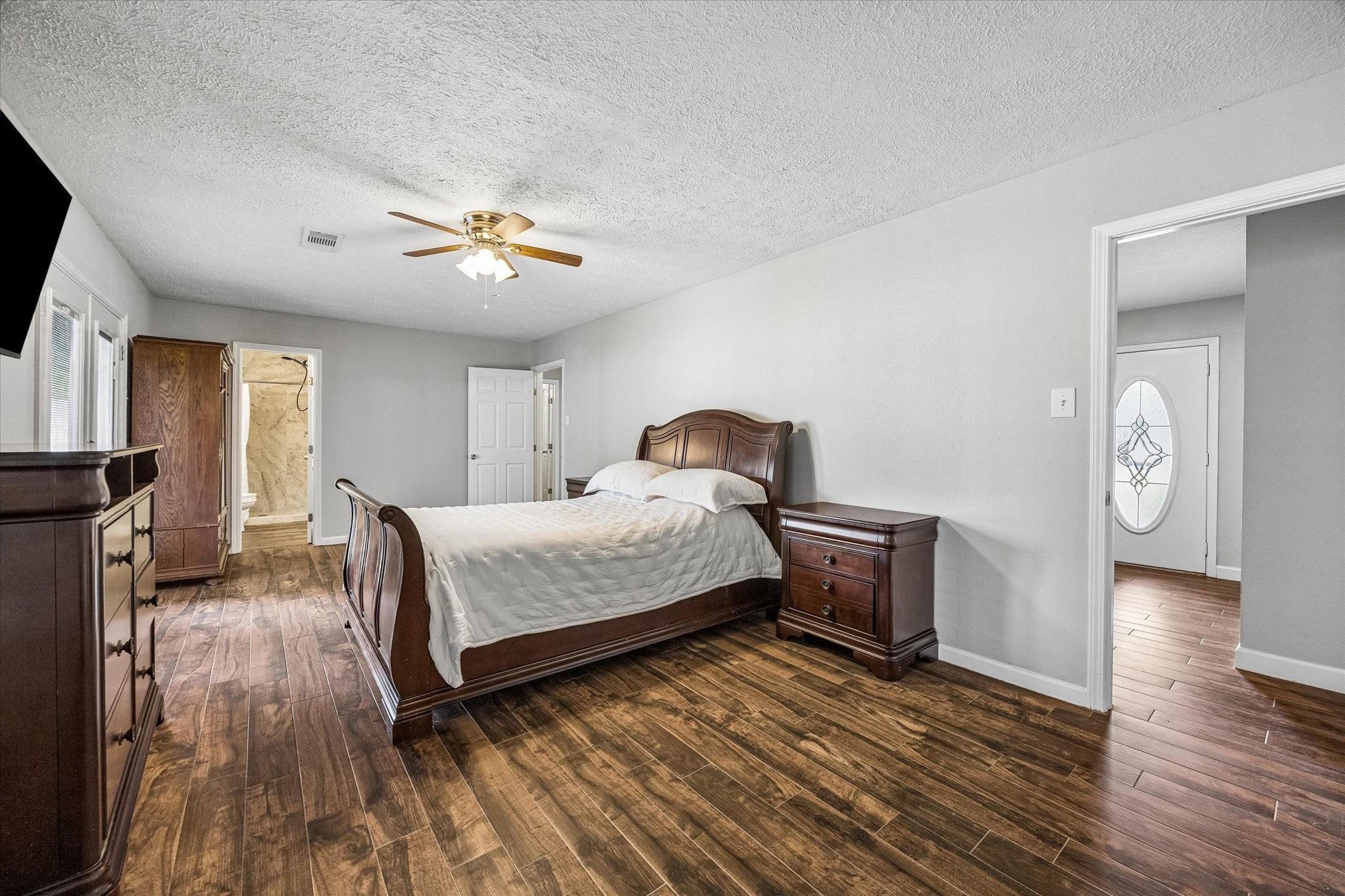 The primary bedroom features the added convenience of an ensuite bathroom, offering privacy and easy access for everyday comfort.