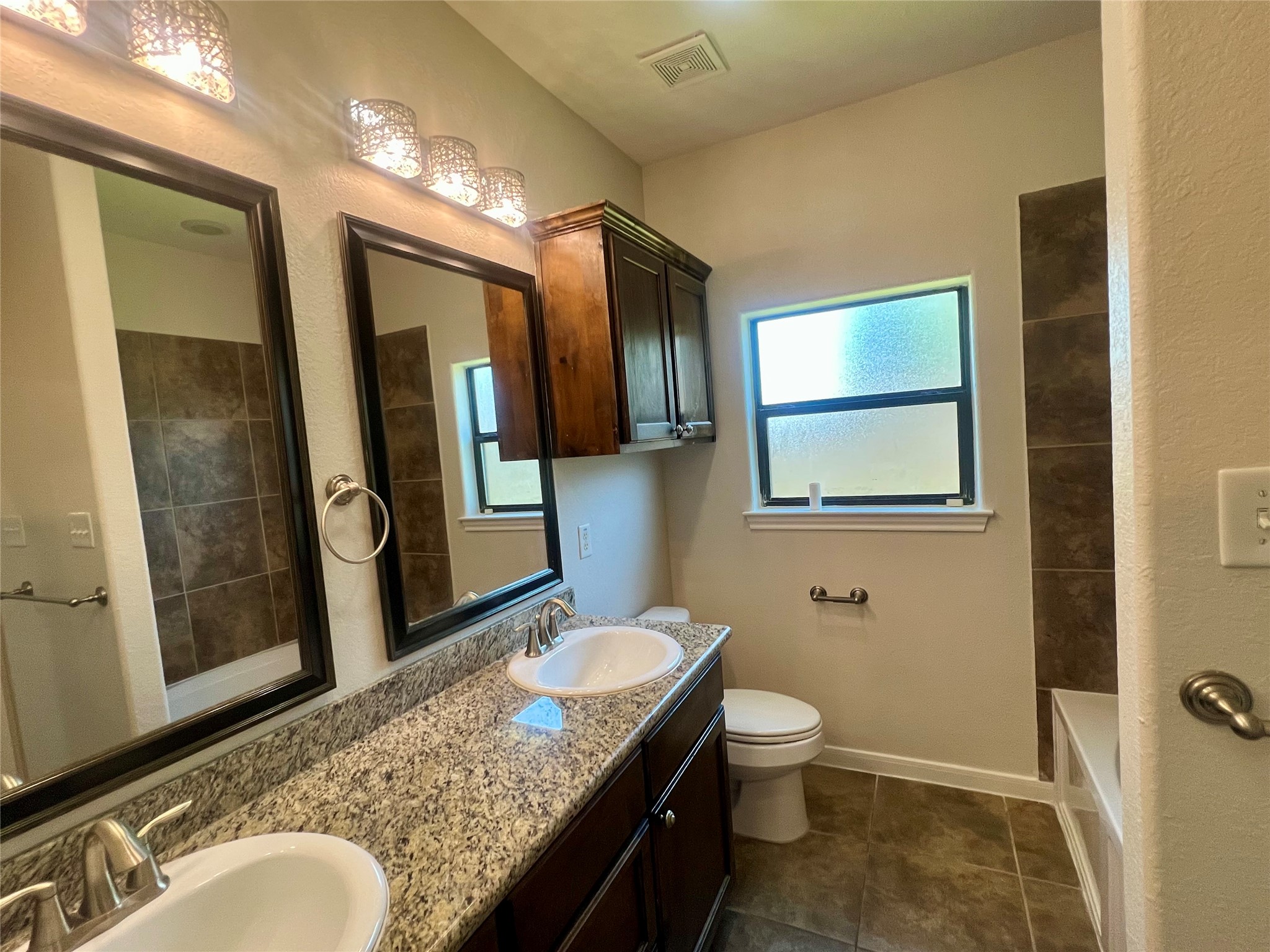 Primary bath with double sinks, separate shower and tub. Primary bath with double sinks, separate shower and tub.