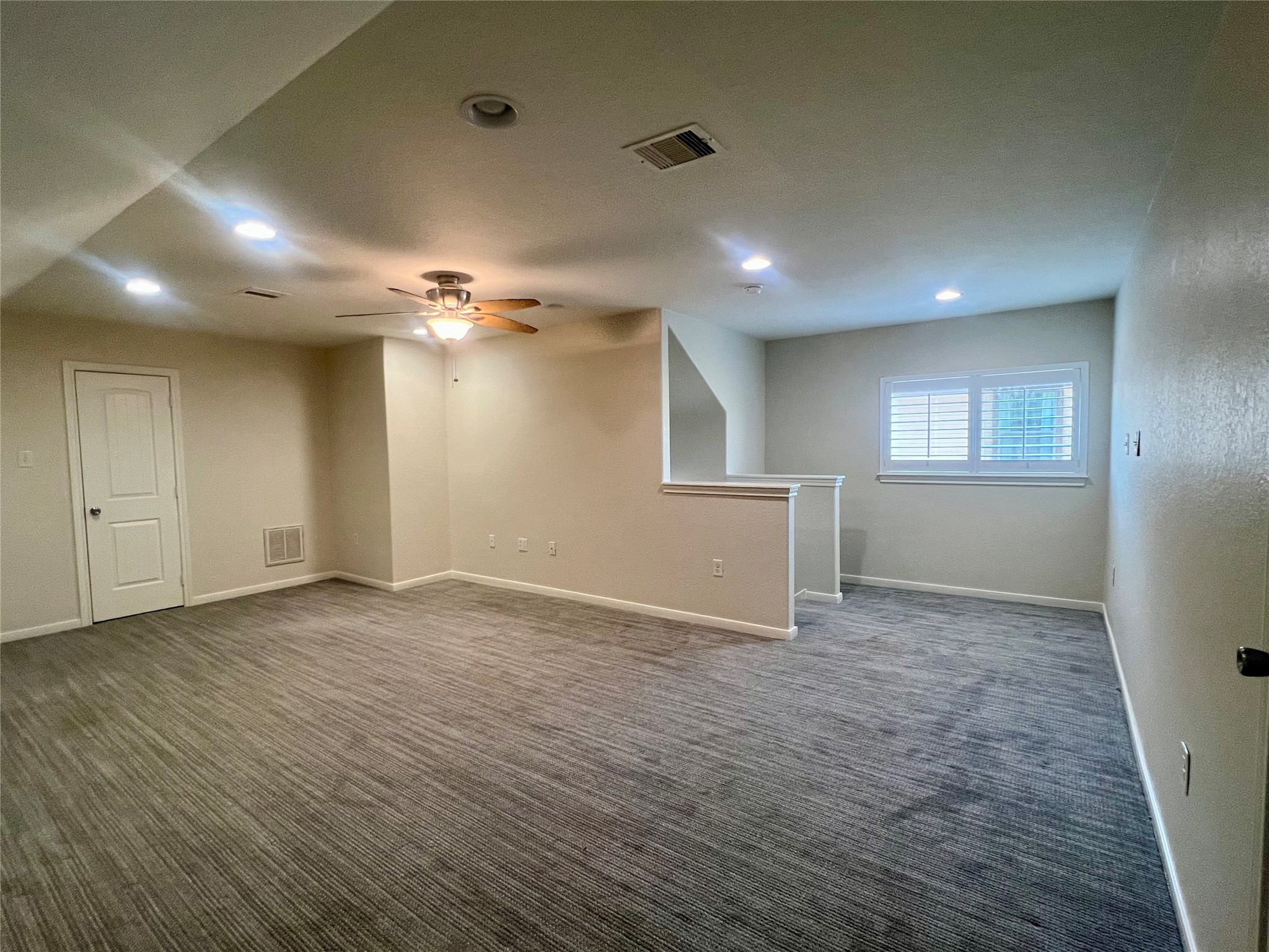 Another view of upstairs flex room.  This room is accessed by stairs carpeted stairs with door for privacy.