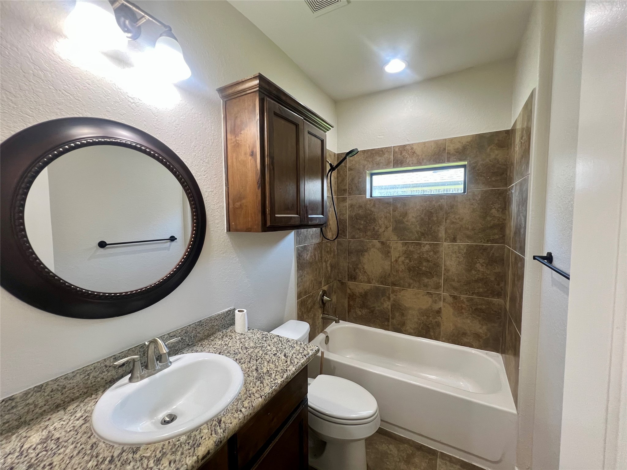 Secondary bathroom located between bedrooms 2 and 3.