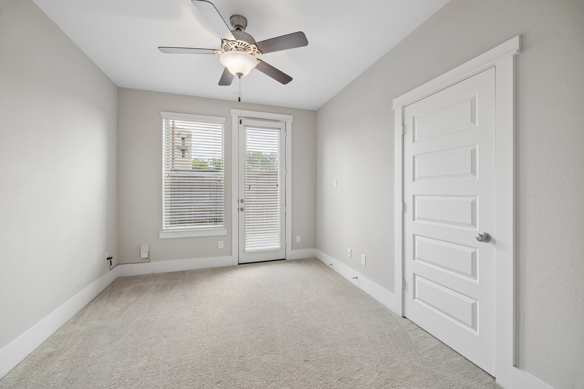 One of two bedrooms located on the first floor, this well-appointed space offers the perfect blend of comfort and flexibility for guests, remote work, or everyday living.