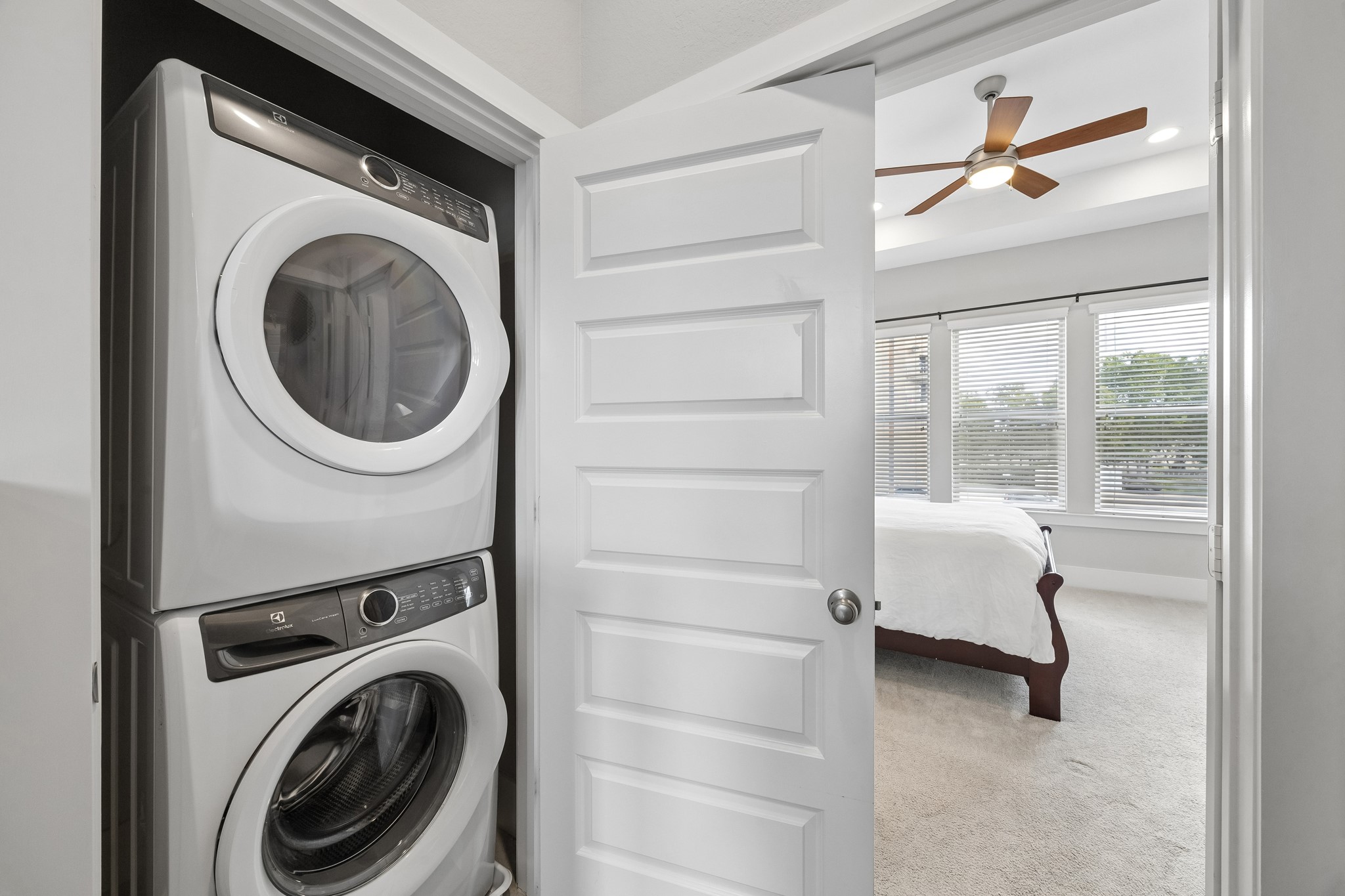 Located just outside the primary suite, the utility area offers added convenience and easy access for everyday living.