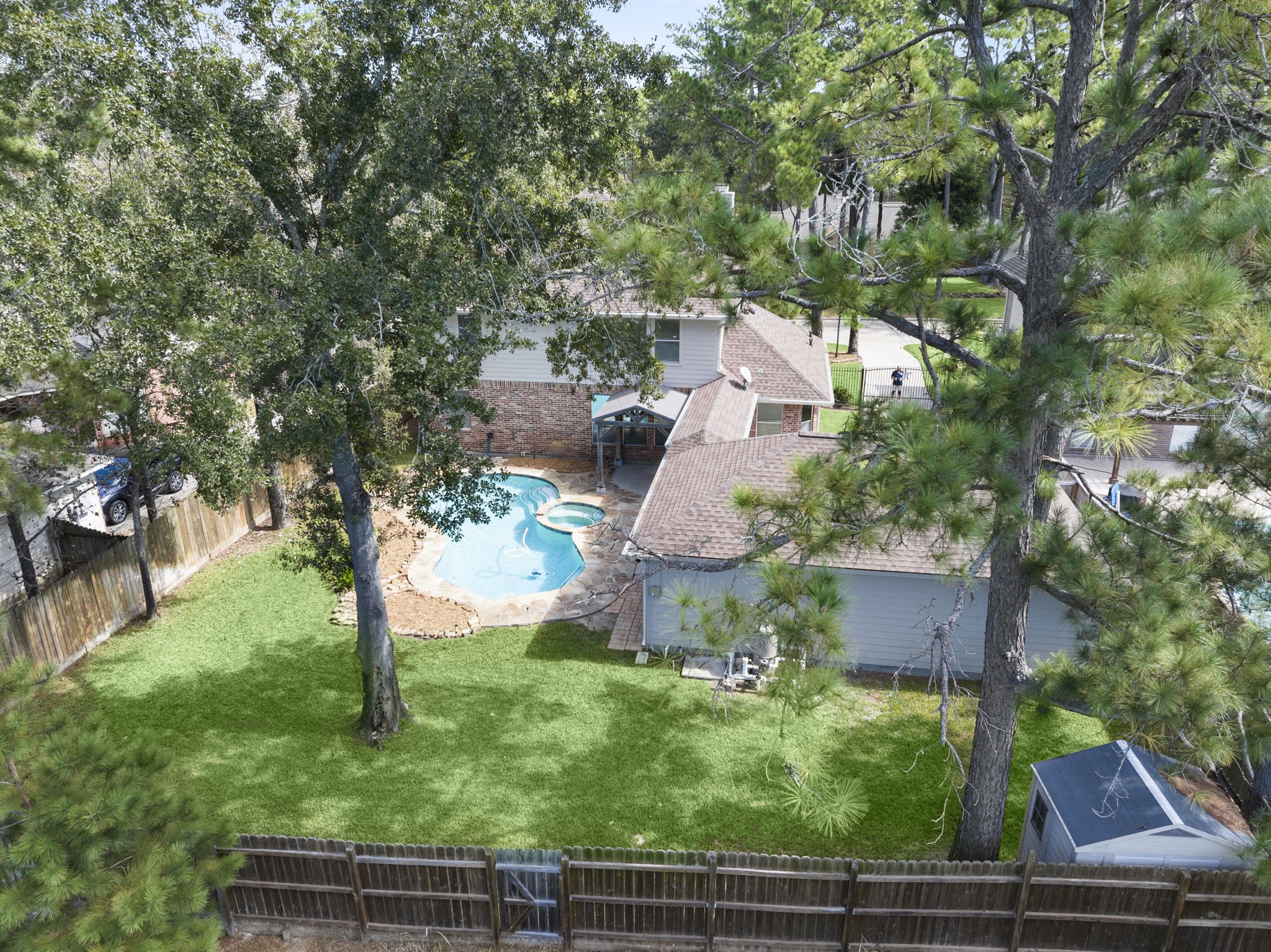 A RARE FIND! Enjoy the privacy of a greenbelt setting with NO REAR NEIGHBORS! This beautiful property features an expansive backyard, sparkling pool, and an extra-long gated driveway leading to a detached 3-car garage, and a covered walkway connecting the garage to the home. AND THIS IS JUST A SNEAK PEEK! Keep scrolling...the best is yet to come!
