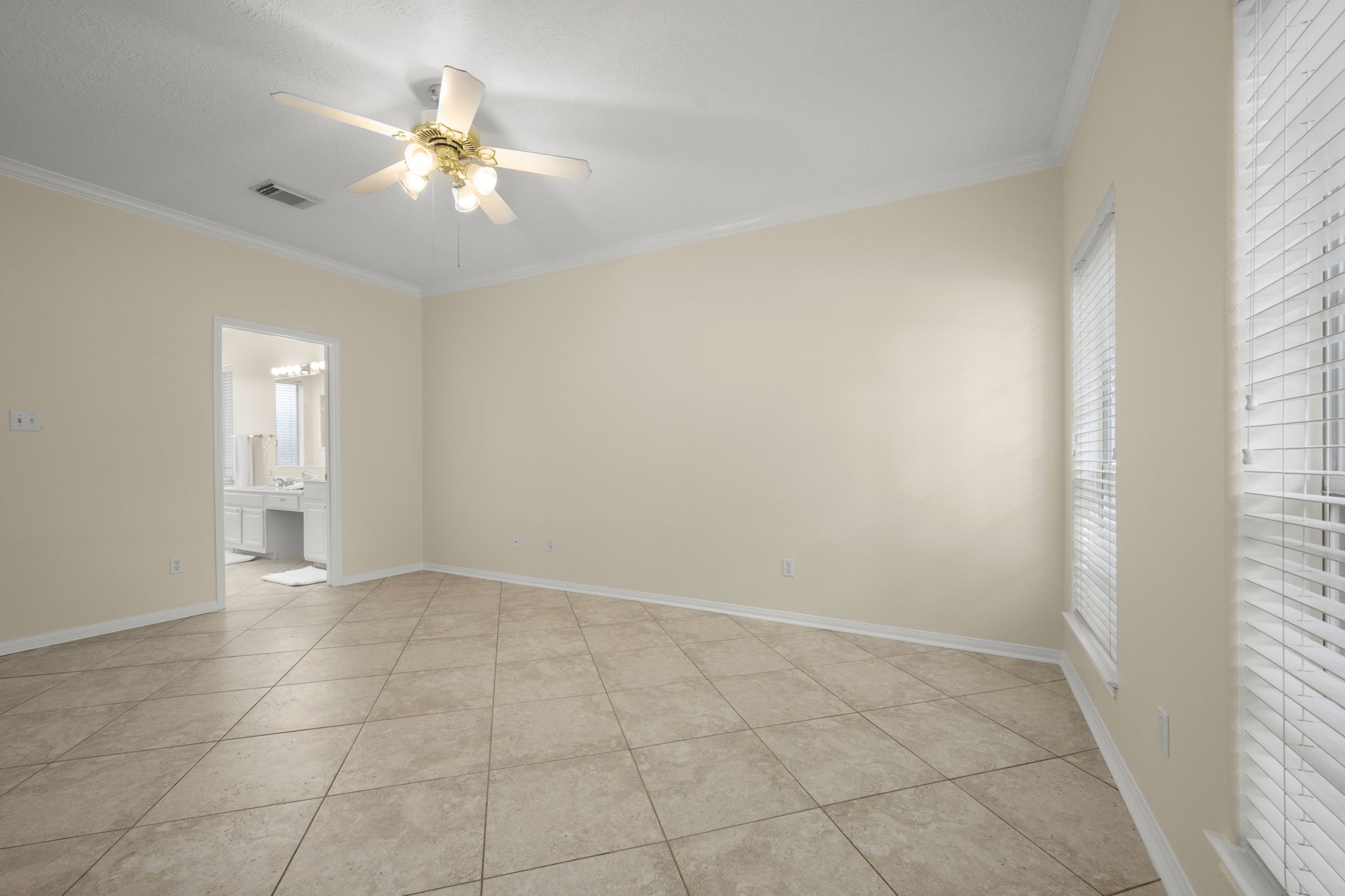 17 x 12 Primary retreat 9' ceilings and lots of natural light with neutral walls makes a perfect canvas for your large king size bed and furniture.