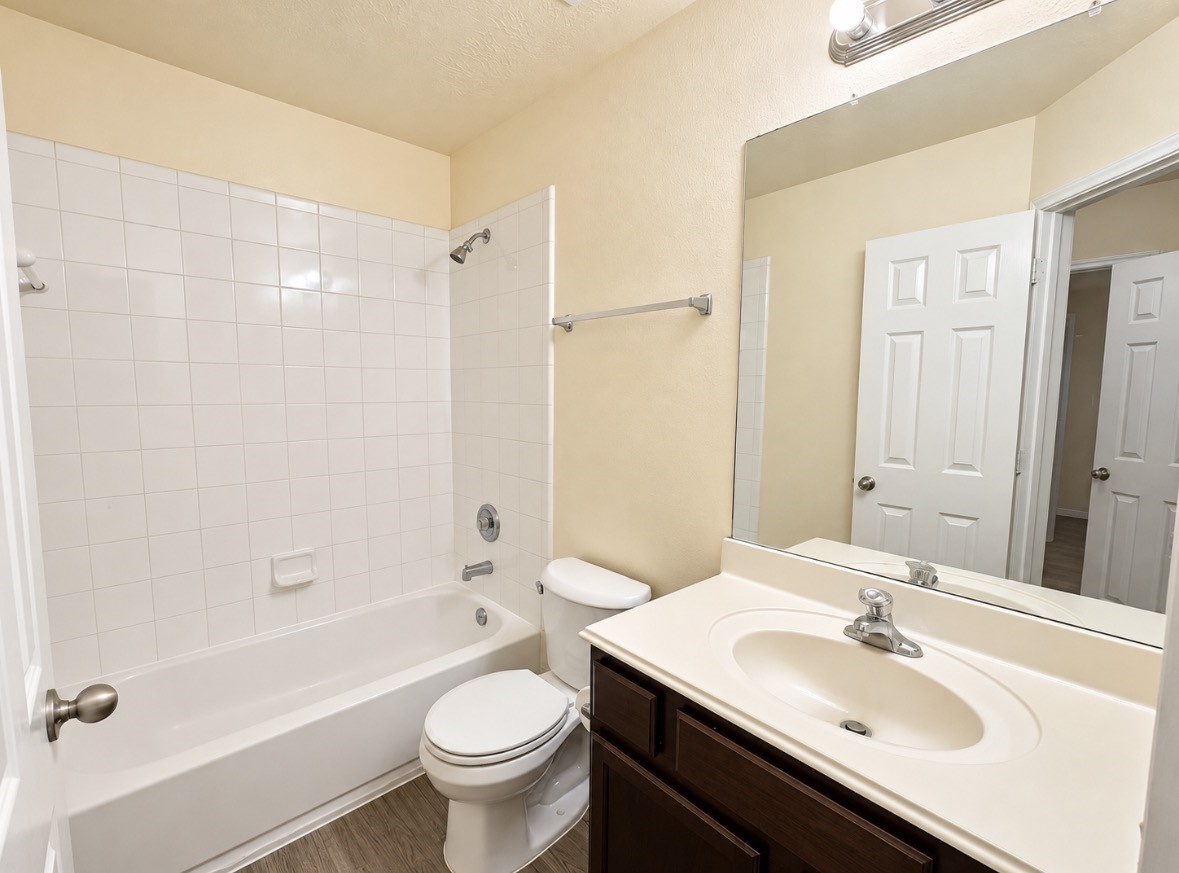 Full secondary bathroom with tub/shower combination, perfect for family or guests.
