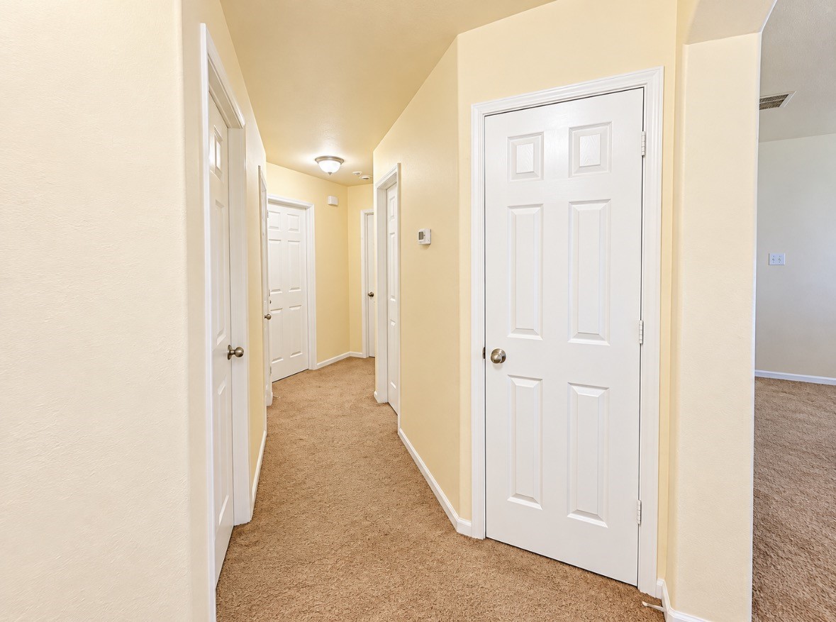 Thoughtfully arranged hallway connecting the bedrooms & living spaces.