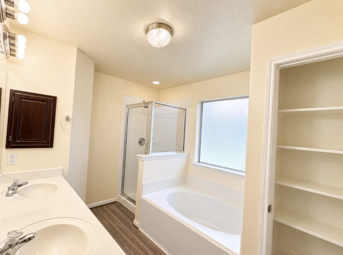 Unwind in your soaking tub after a long day, with a separate shower & convenient storage nearby.