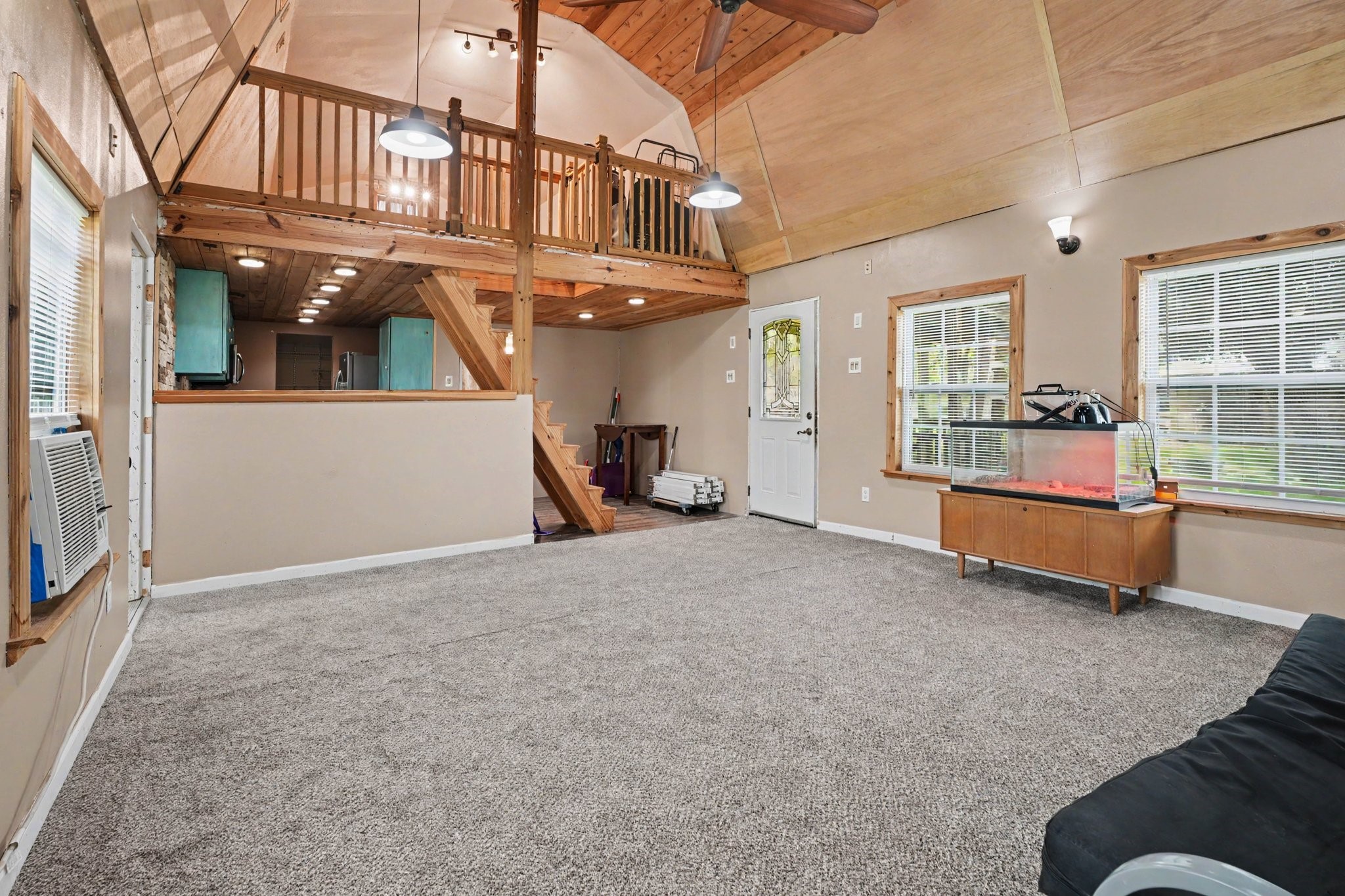 Guest house living area with loft and ktchen view