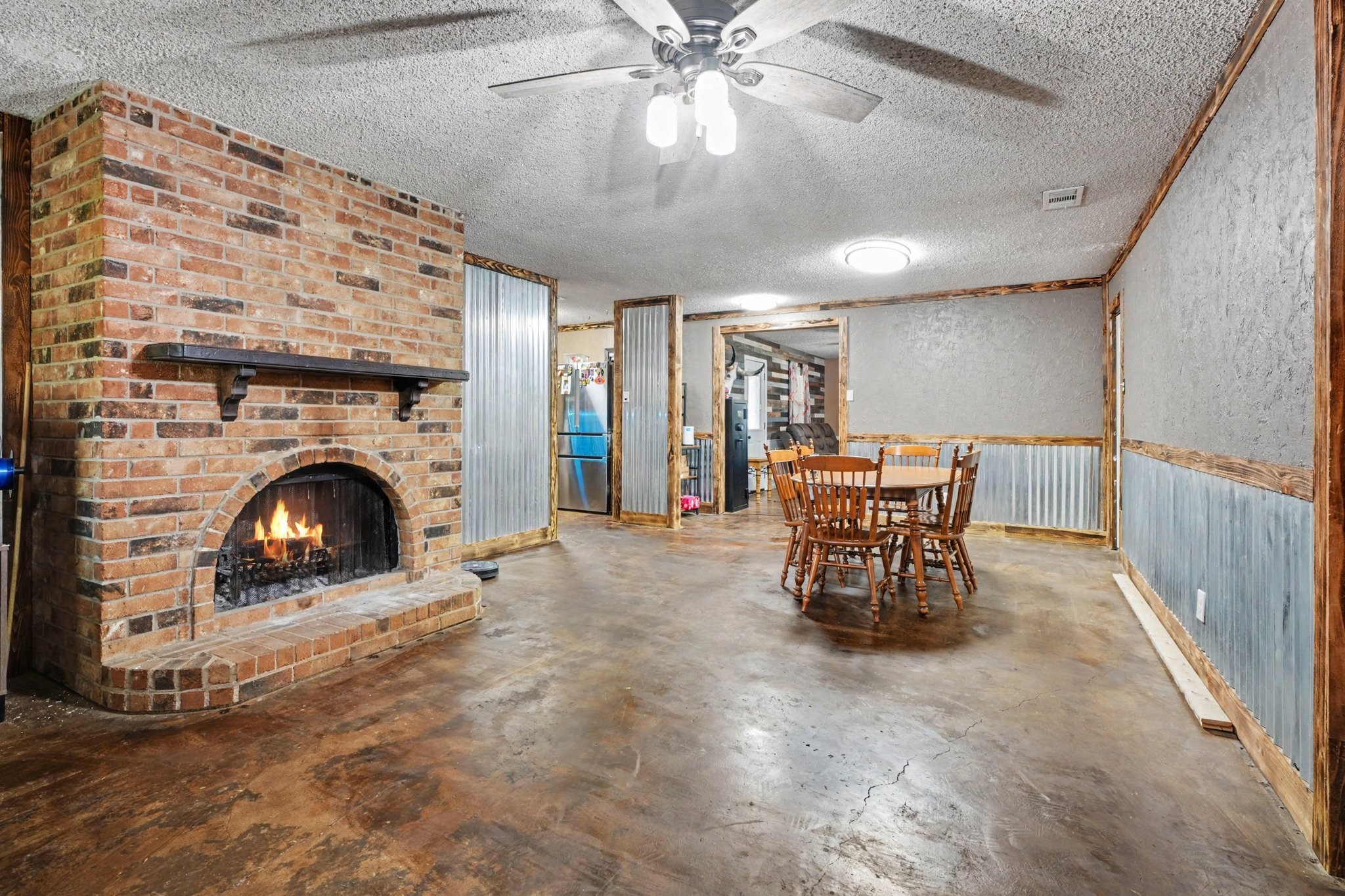 Second view of dining room with fireplace
