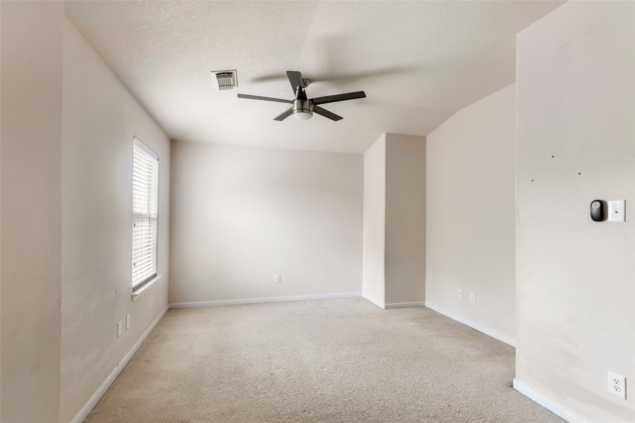 Versatile upstairs game room, ideal for movie nights, a playroom, or additional living space.