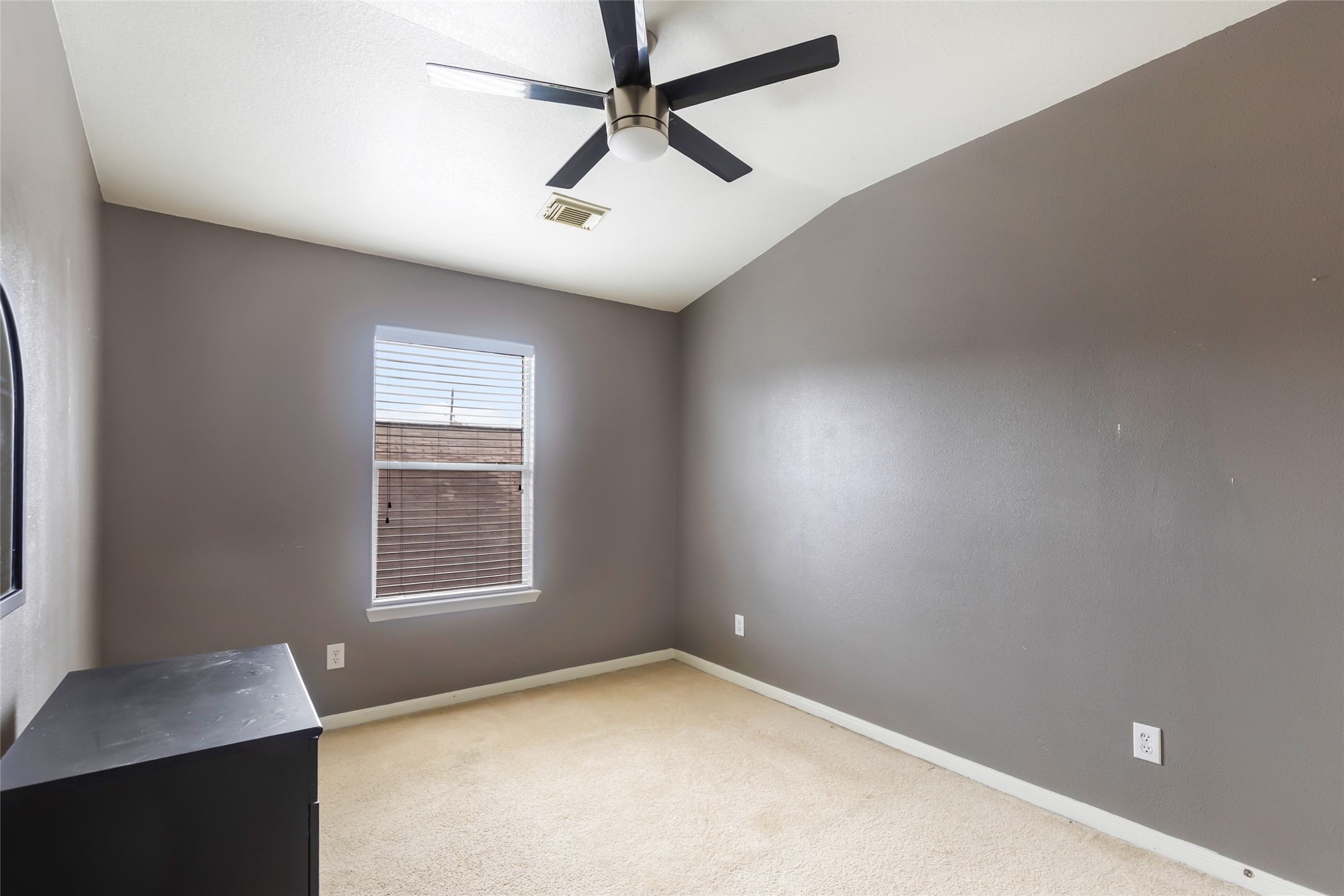 Comfortable secondary bedroom with flexibility for family or guests.