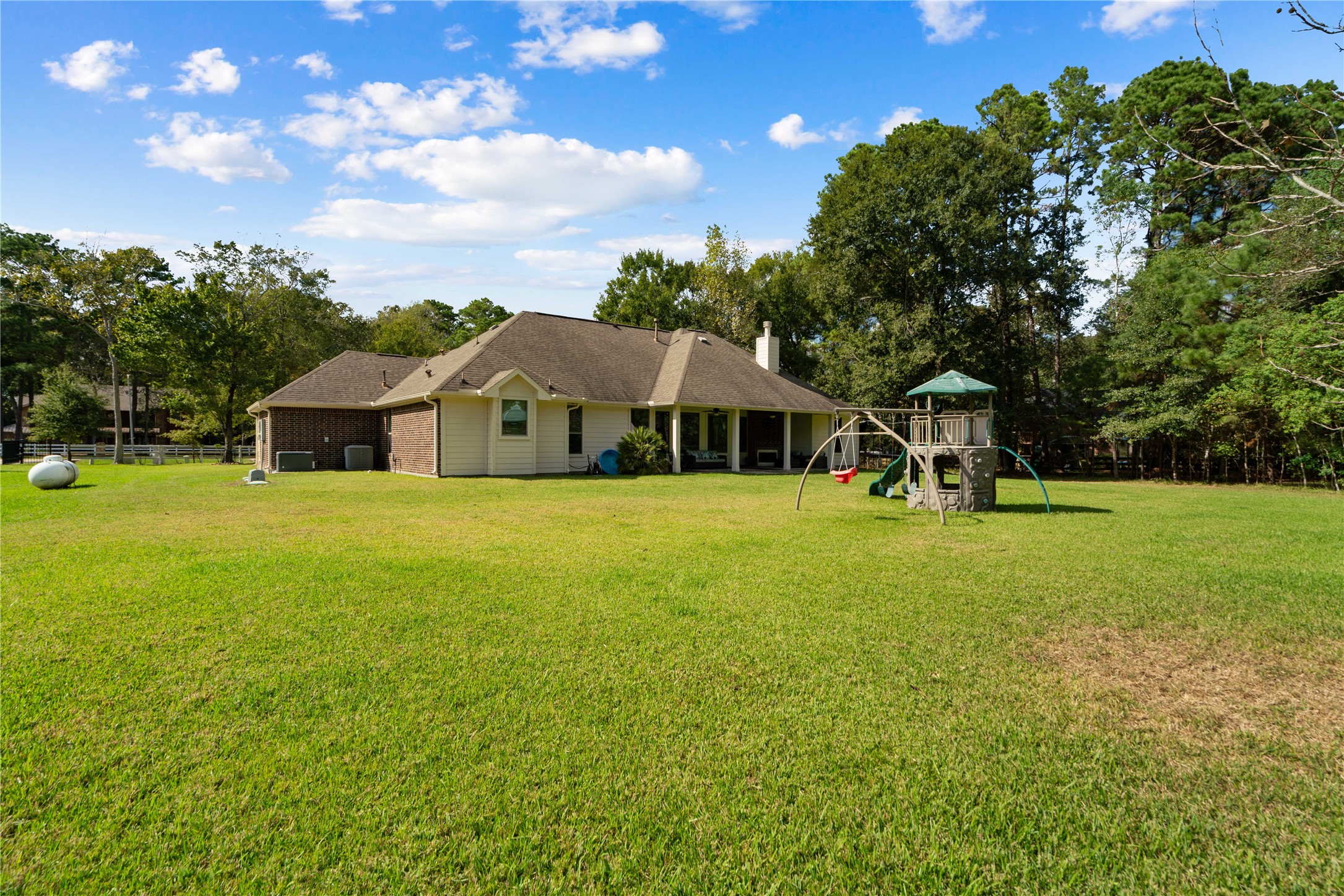 Now THIS is a backyard! An incredible stretch of green space creates the perfect backdrop for outdoor fun, entertaining, or simply enjoying the peace and quiet.