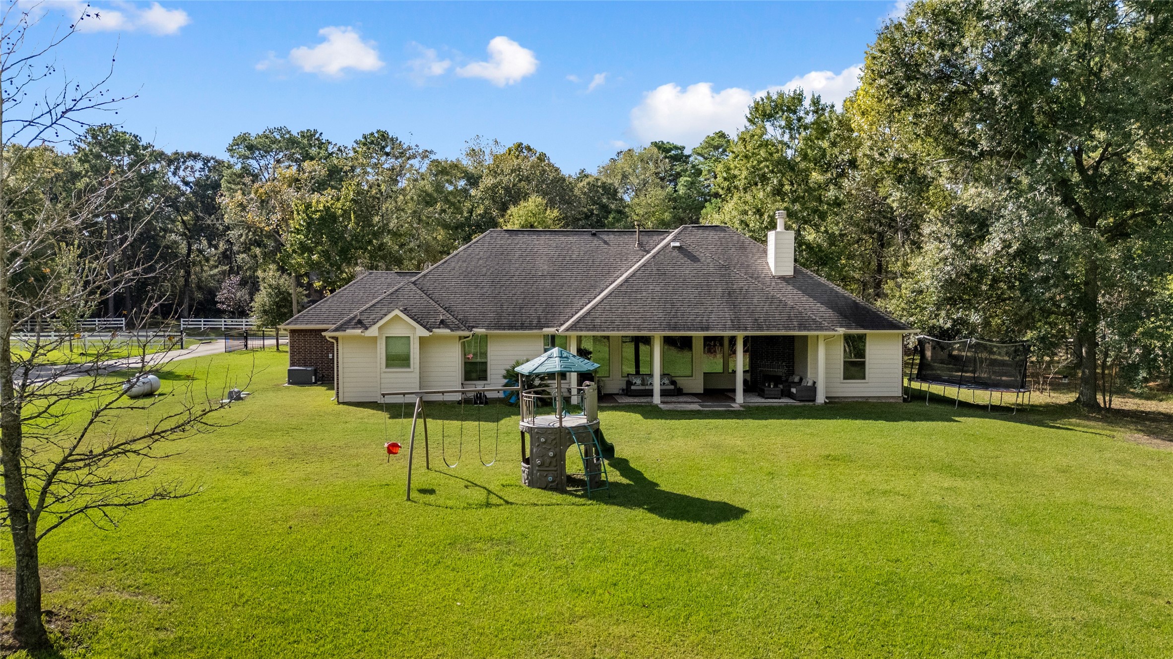 A backyard that truly delivers! Enjoy the rare combination of a beautiful home, expansive lawn, and a peaceful, wooded backdrop.