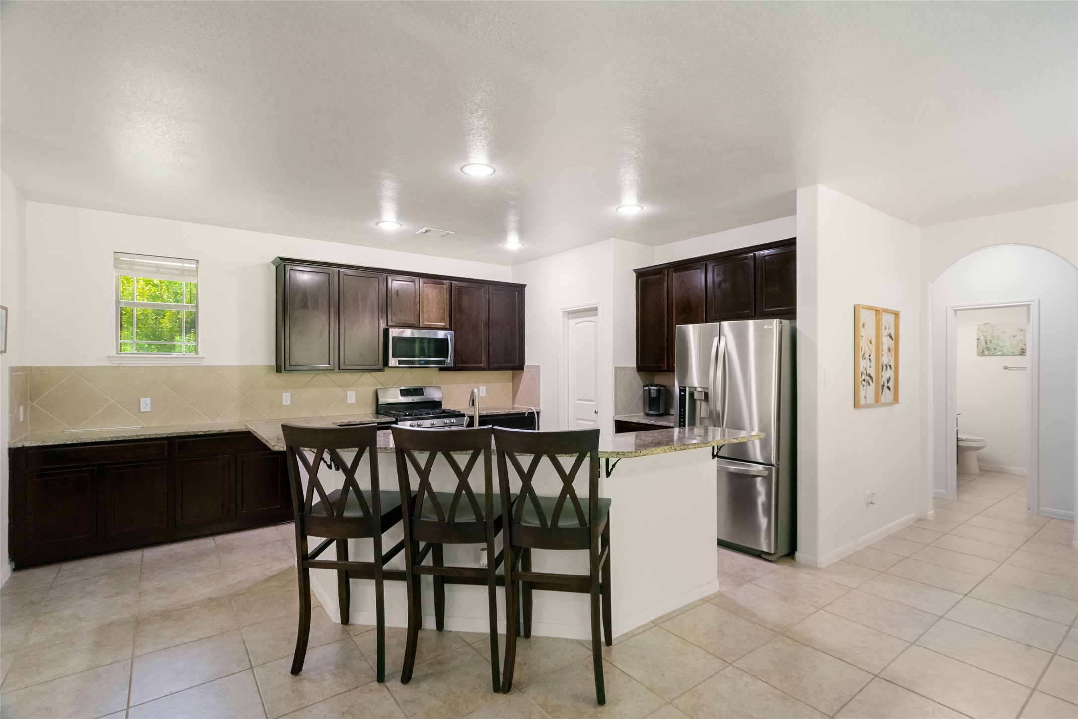 Pull up a chair and stay awhile! The kitchen and dining area flow together beautifully for effortless everyday living.
