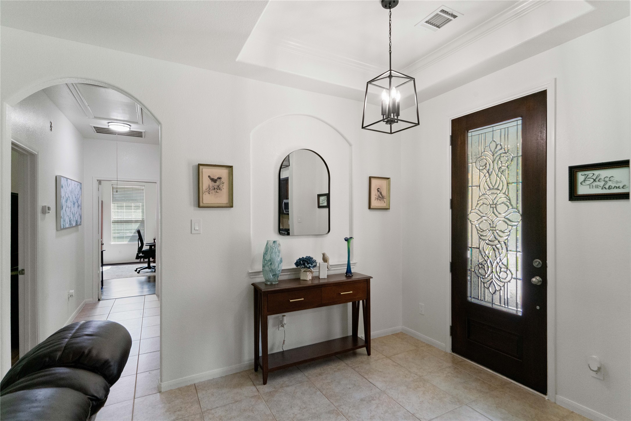 First impressions matter! A bright, welcoming entry with elegant architectural details offers a beautiful introduction to the home.