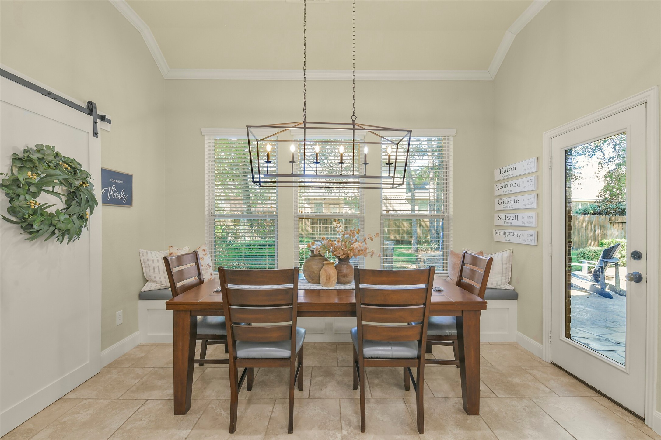 Bright breakfast area overlooking the backyard, with large windows and plenty of natural light.