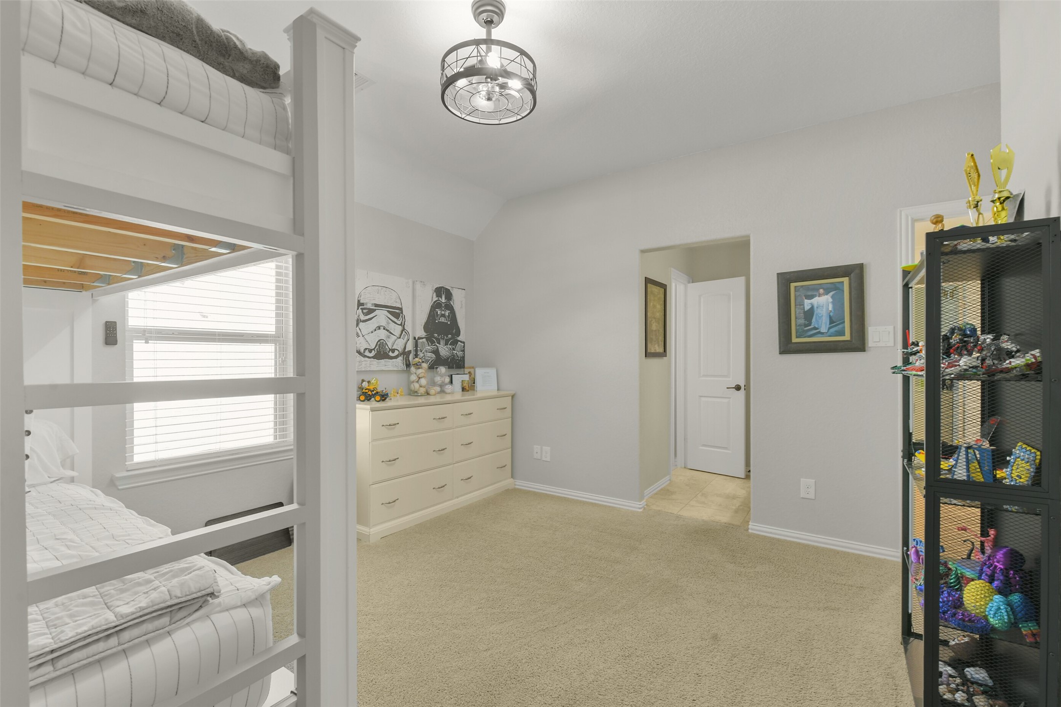 Versatile upstairs bonus room offering flexible space for a game room, playroom, or hobby area.