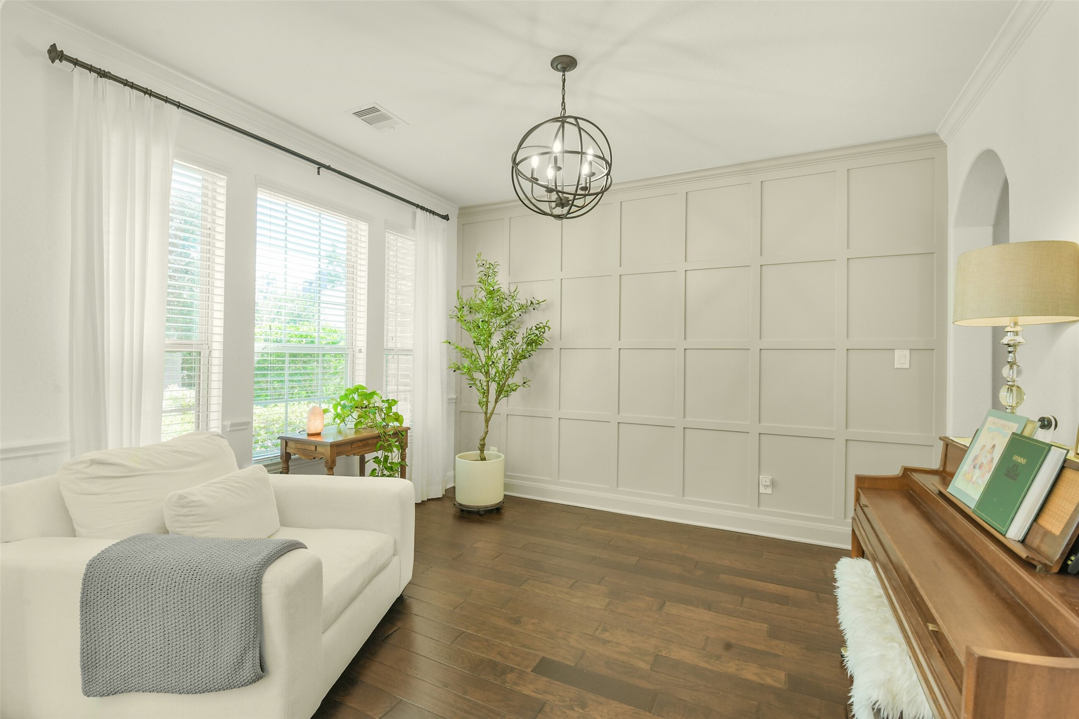 Spacious primary bedroom with abundant natural light and room for additional furnishings.