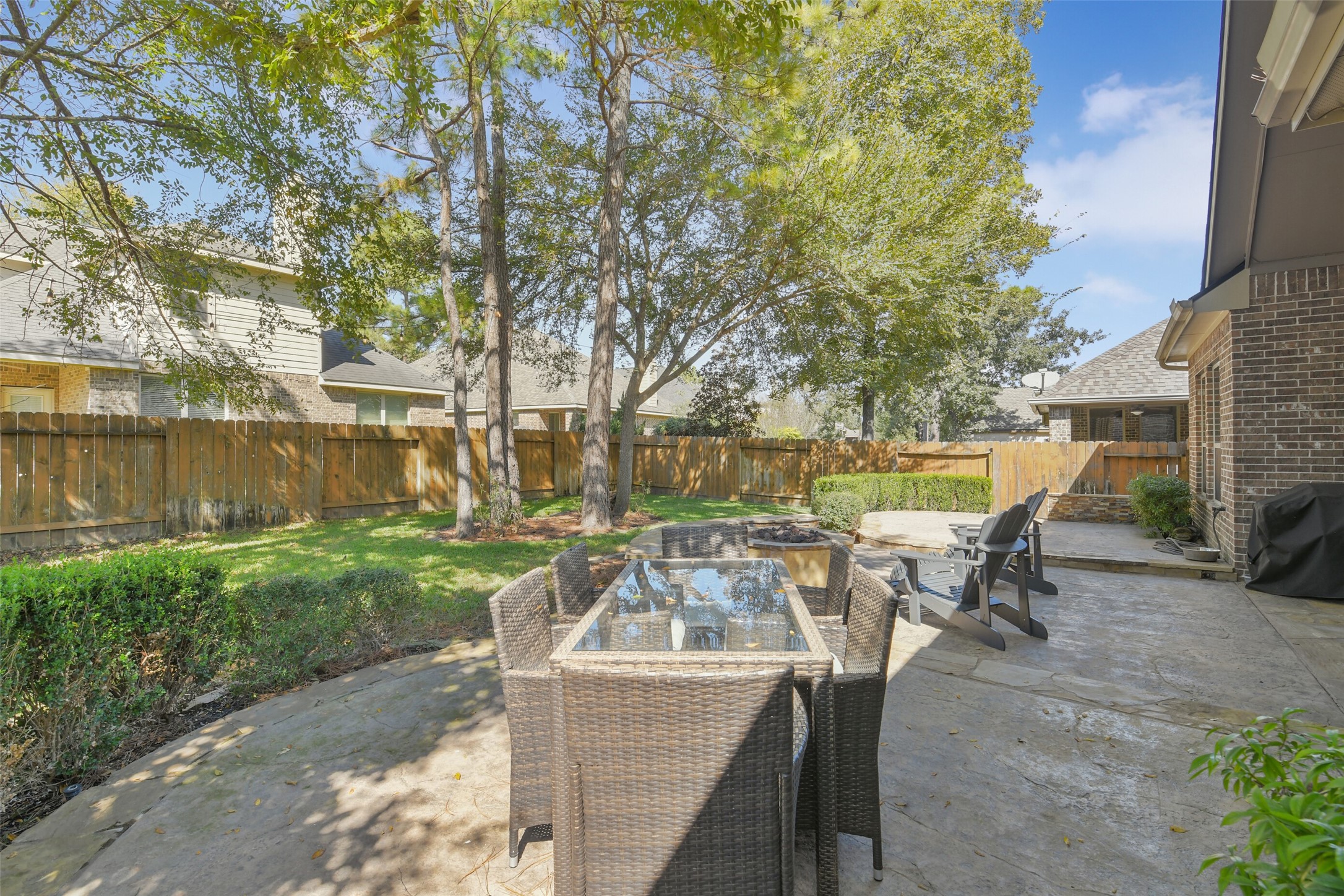 Beautiful outdoor entertaining area featuring an inviting patio and peaceful backyard views.