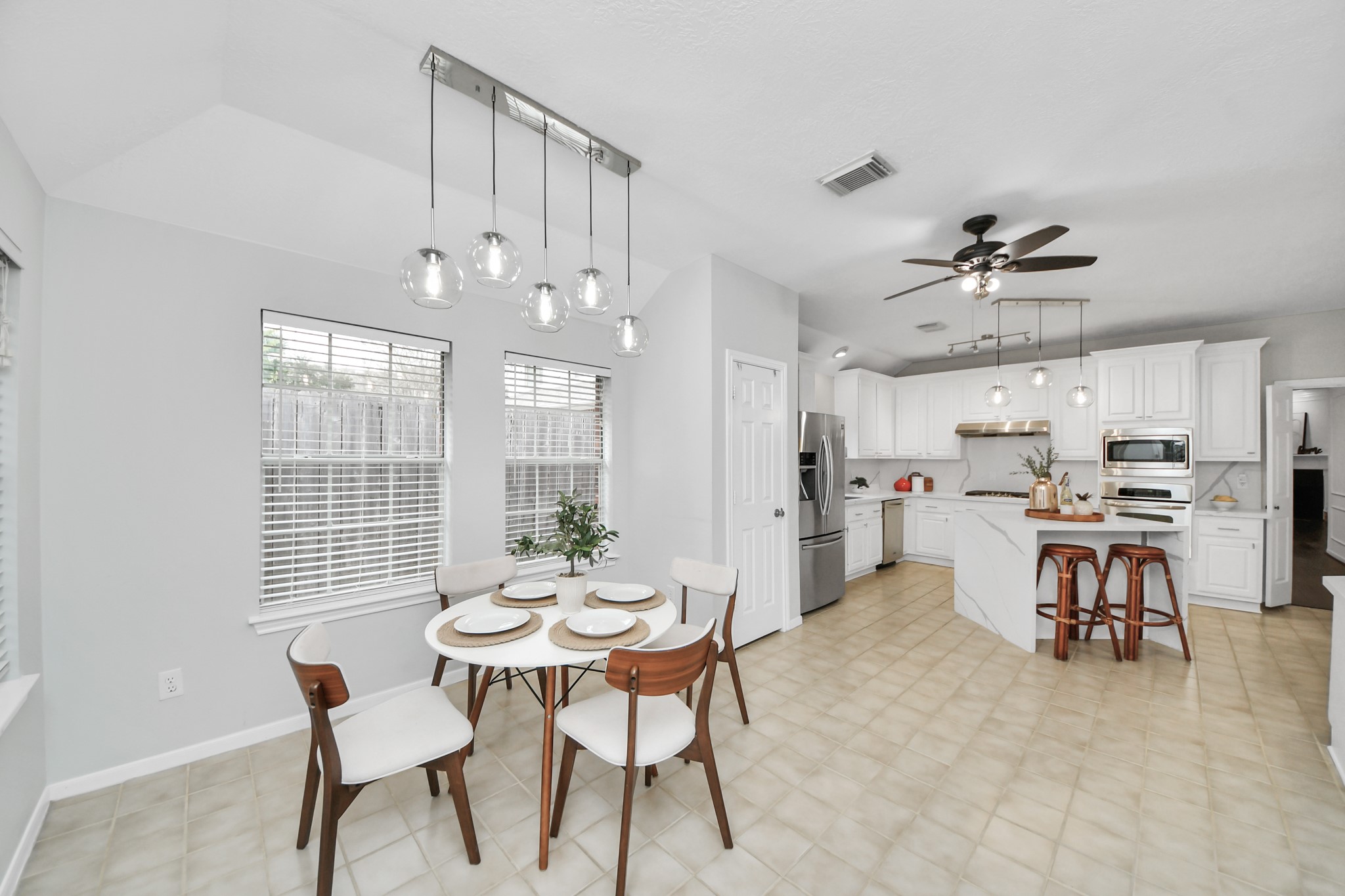 A bright breakfast area right off the kitchen, with large windows and plenty of natural light. A nice spot for everyday meals or your morning coffee.
