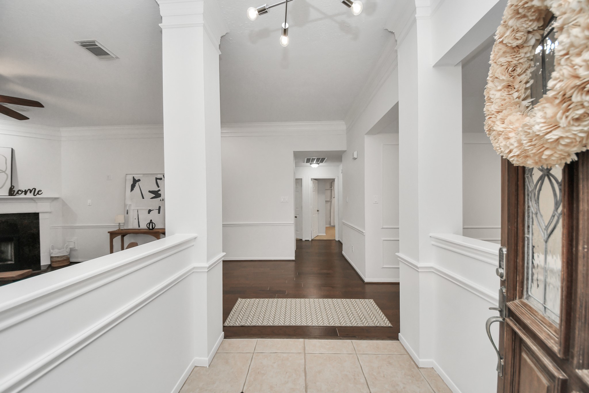 As you walk in, youll notice the high ceilings, fresh paint, and wood floors. The living room is to your left and the dining room to your right.