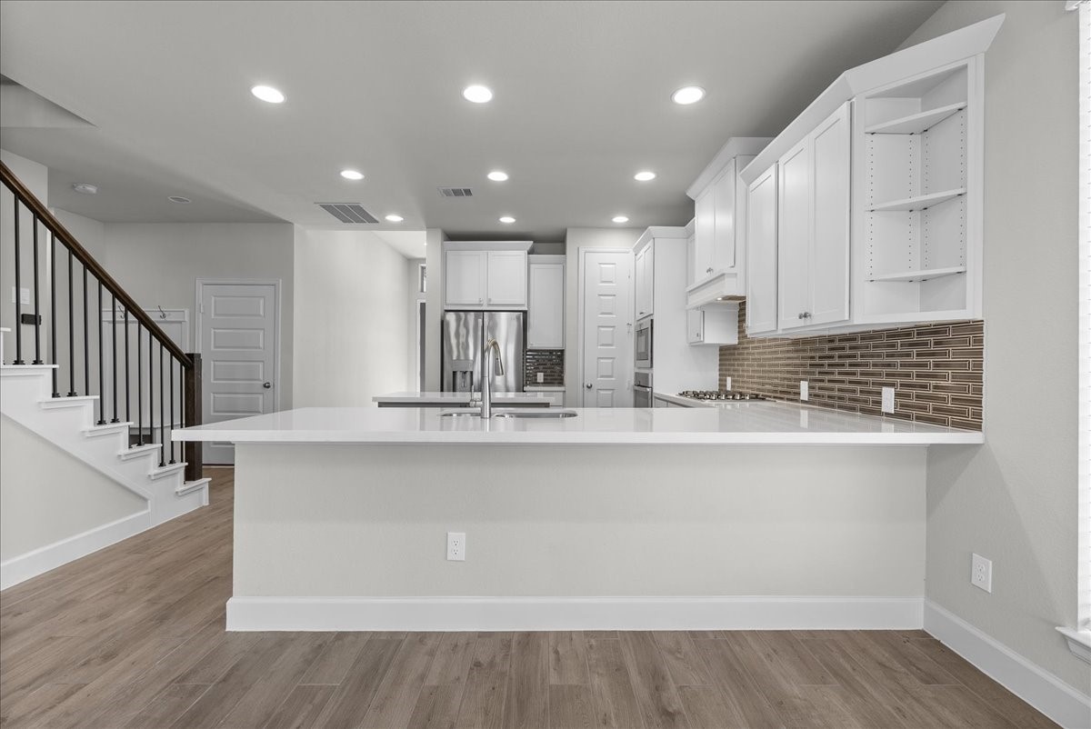 Dining area open to kitchen and living room.