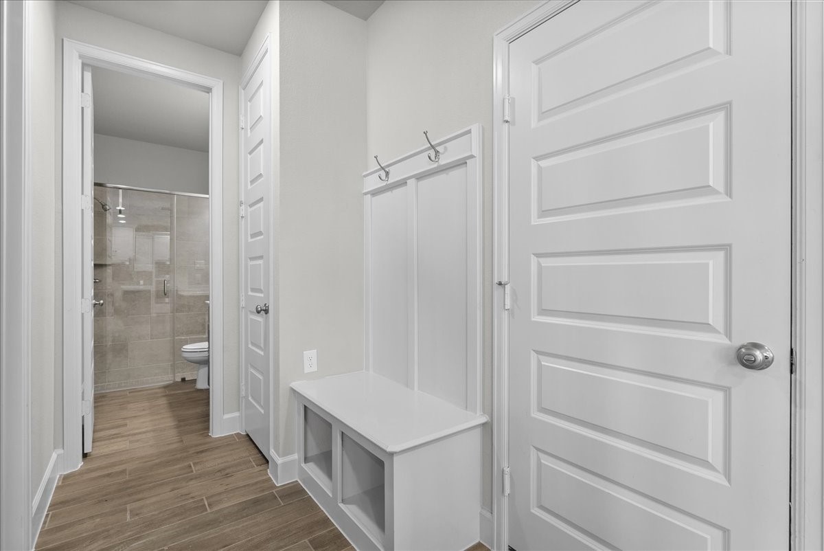Mud room area, great for shoes and backpacks! Garage is on the right.
