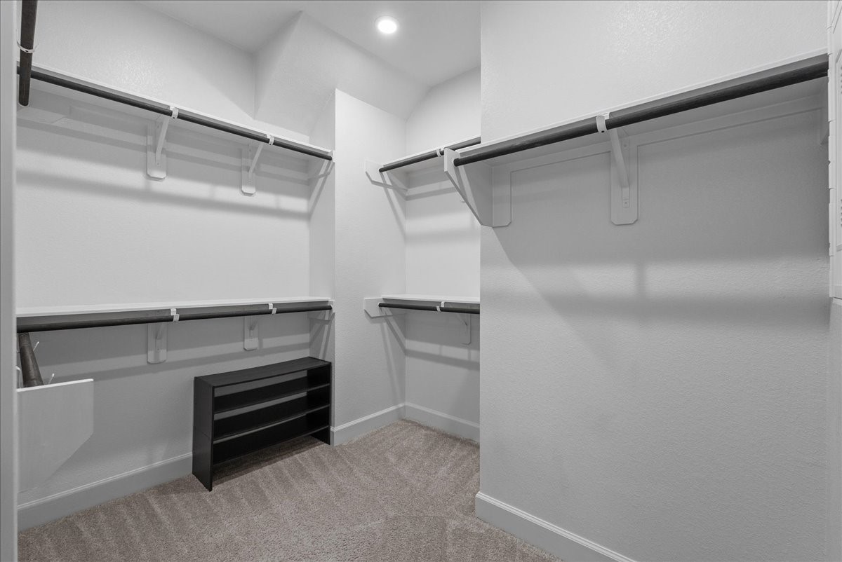 Large primary walk-in closet.