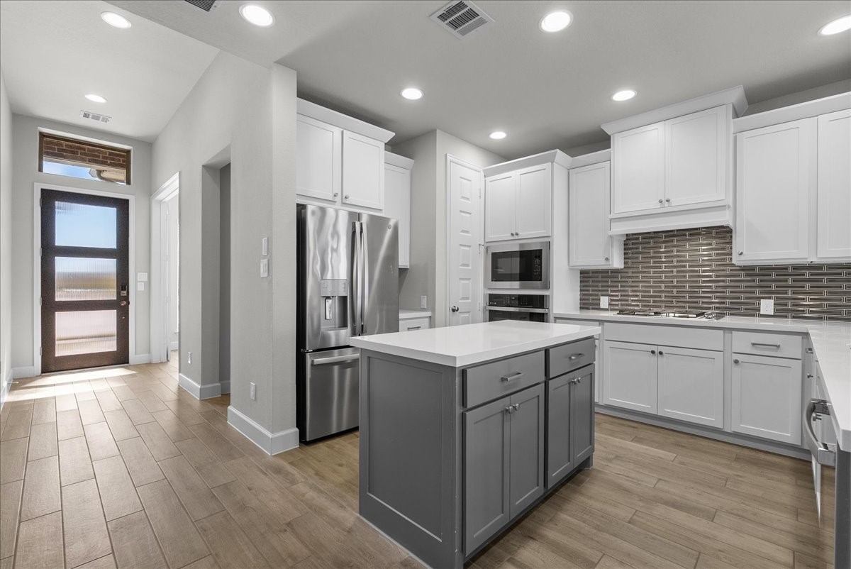 As you continue to enter the home a chef's delight awaits in this amazing kitchen! Refrigerator is included with this home!