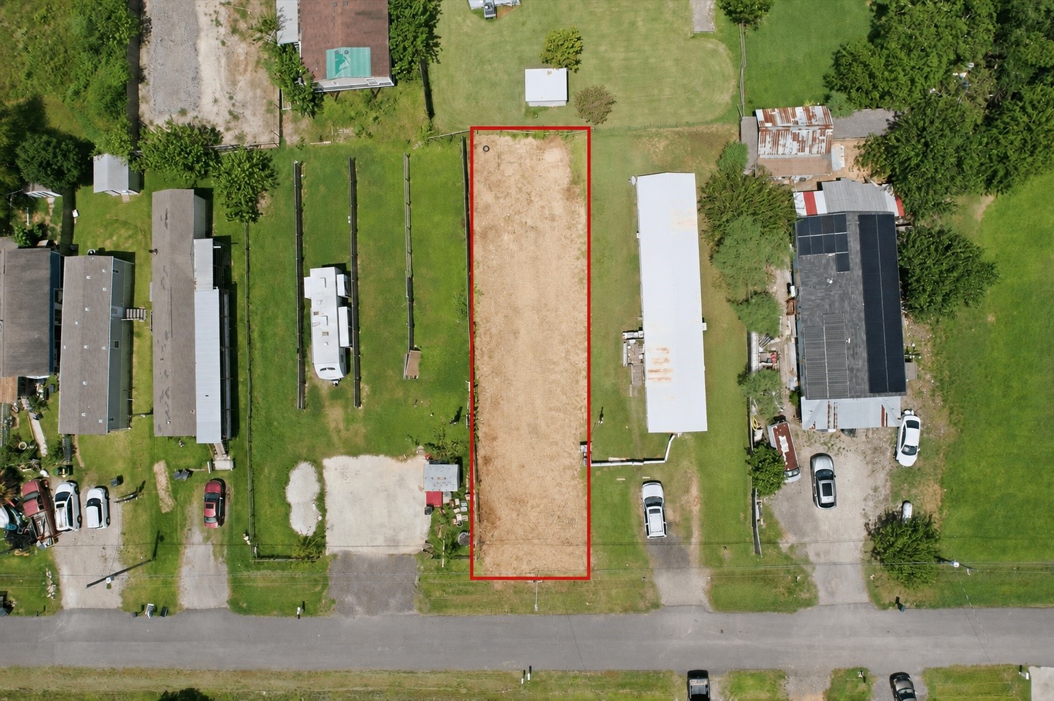 Top Aerial View. Centerpoint added 2 utlity poles, one with new light, on either side of front of the lot Aug 2026.