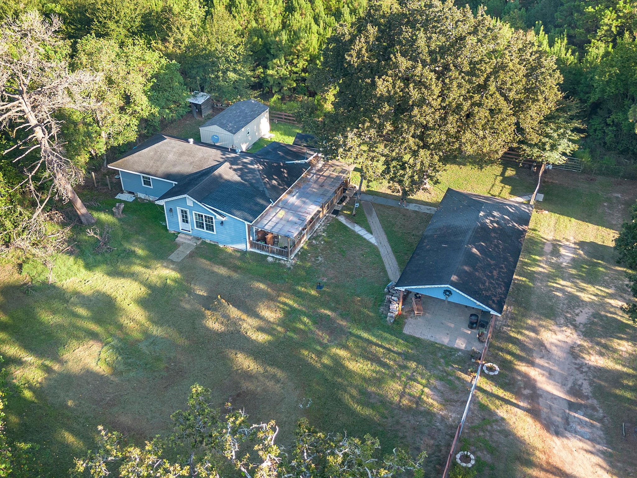 Aerial view of Structures 3 and 4. Structure 3 features a 2-bedroom, 2-bath layout, while Structure 4 offers a 1-bedroom layout, providing additional space and flexibility on the property. Aerial view of Structures 3 and 4. Structure 3 features a 2-bedroom, 2-bath layout, while Structure 4 offers a 1-bedroom layout, providing additional space and flexibility on the property.
