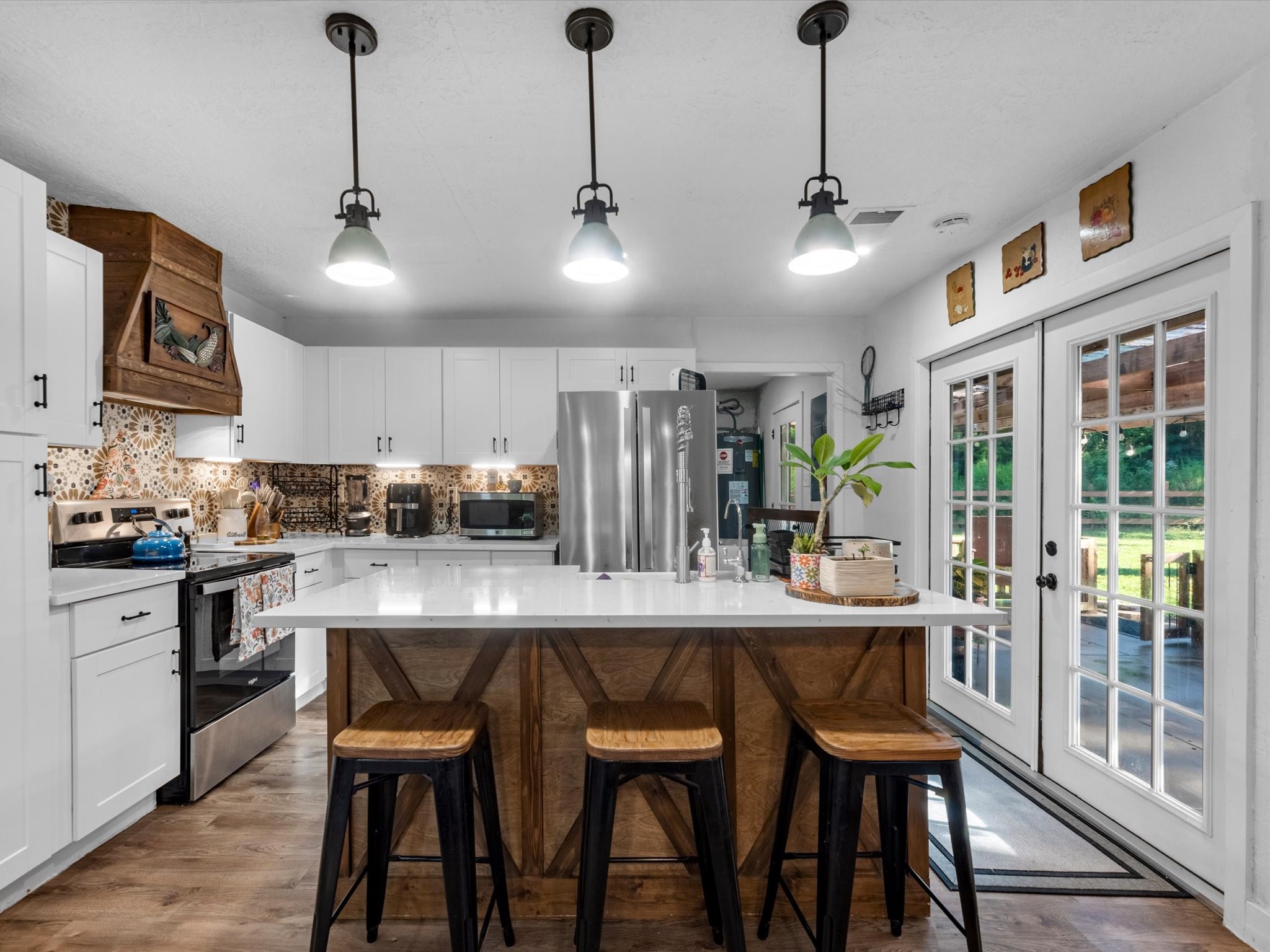 Farmhouse-style kitchen featuring a classic farmhouse sink, spacious island, and a rustic-modern design that blends warmth with updated finishes.