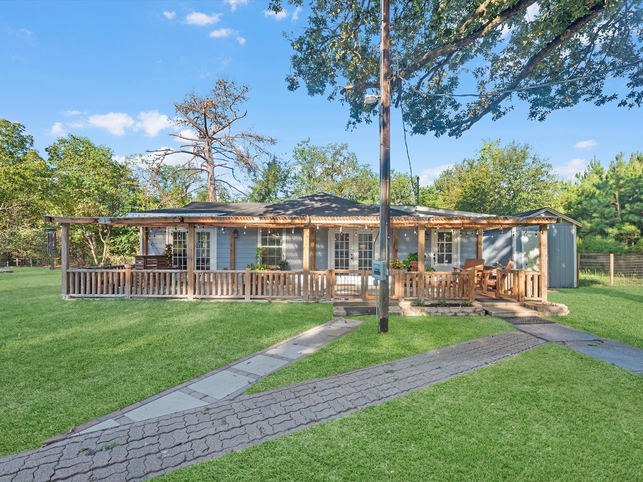 Recently renovated 2-bedroom, 2-bath home offering approximately 1,250 sq ft of living space with a welcoming front porch.