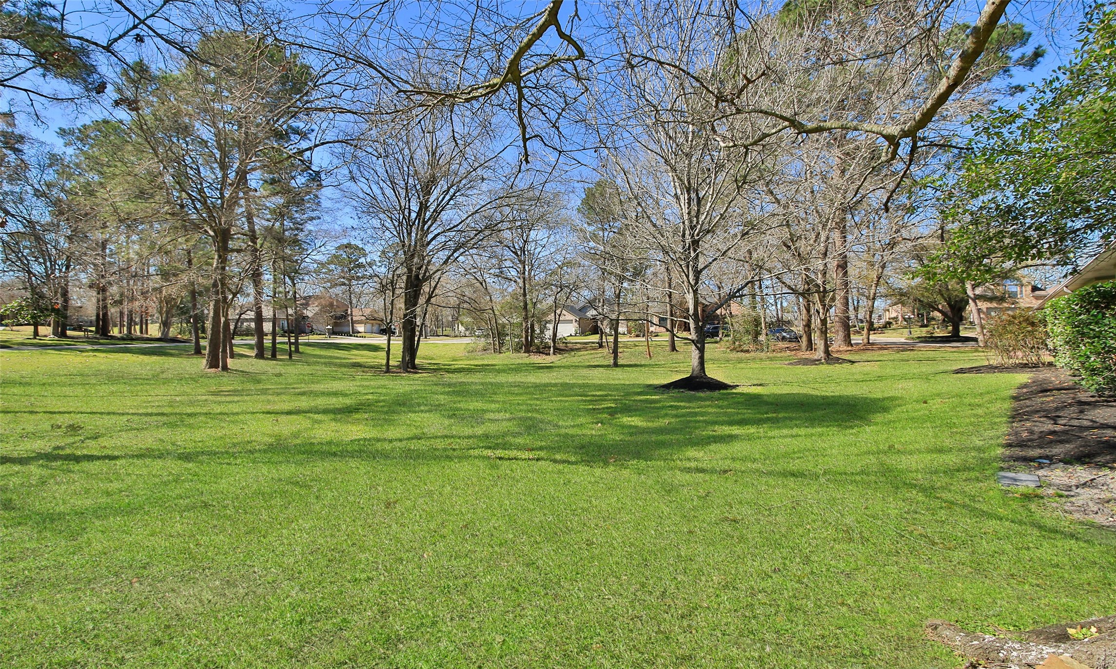 Build your dream home on this beautifully treed lot (6,312 SF per tax records) in Bentwater.