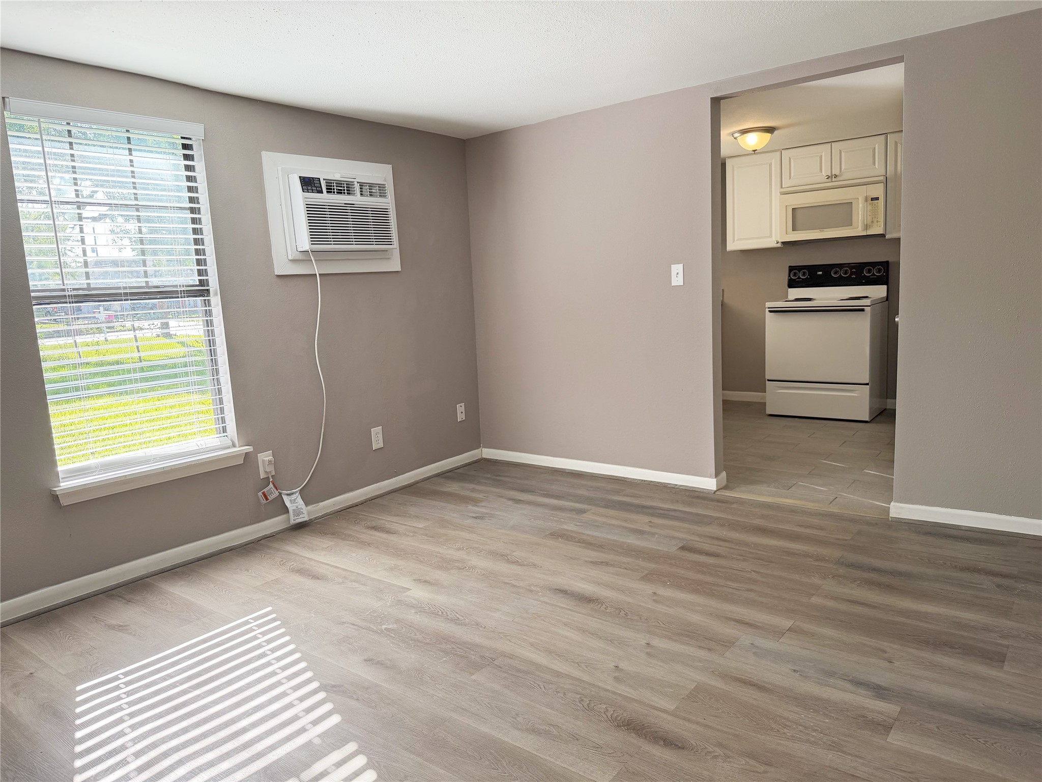 Small family room welcomes you into the garage apartment and provides a comfortable space for seating and everyday use