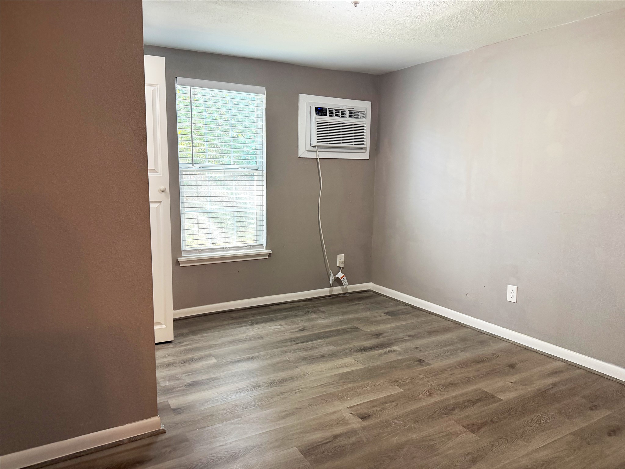 Garage apartment includes two separate bedrooms, each offering functional space for bedroom furnishings and storage.