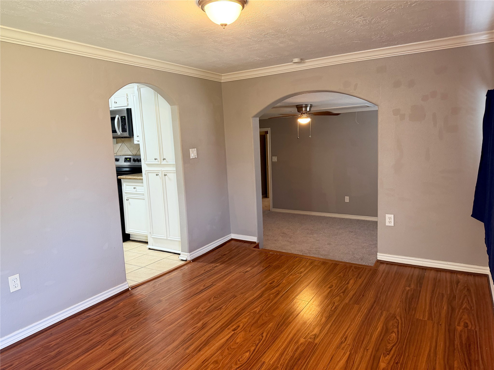 Front room features laminate flooring and provides access to several adjoining rooms throughout the home Front room features laminate flooring and provides access to several adjoining rooms throughout the home