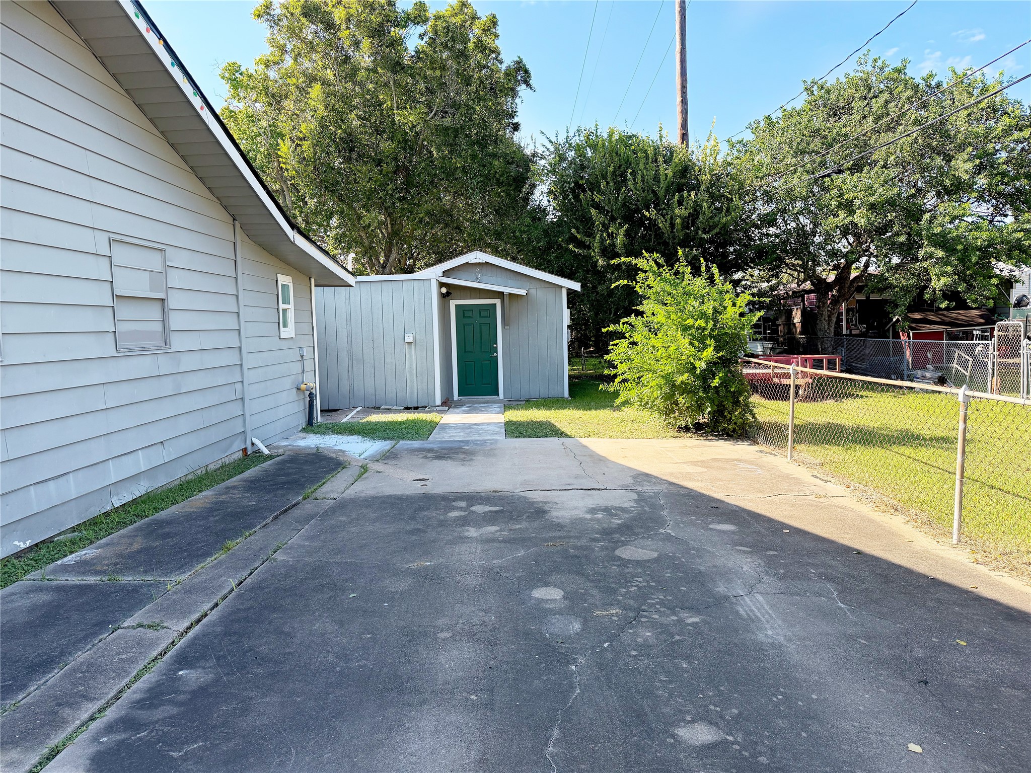 Driveway provides convenient parking and access to the separate garage apartment located at the rear of the property.