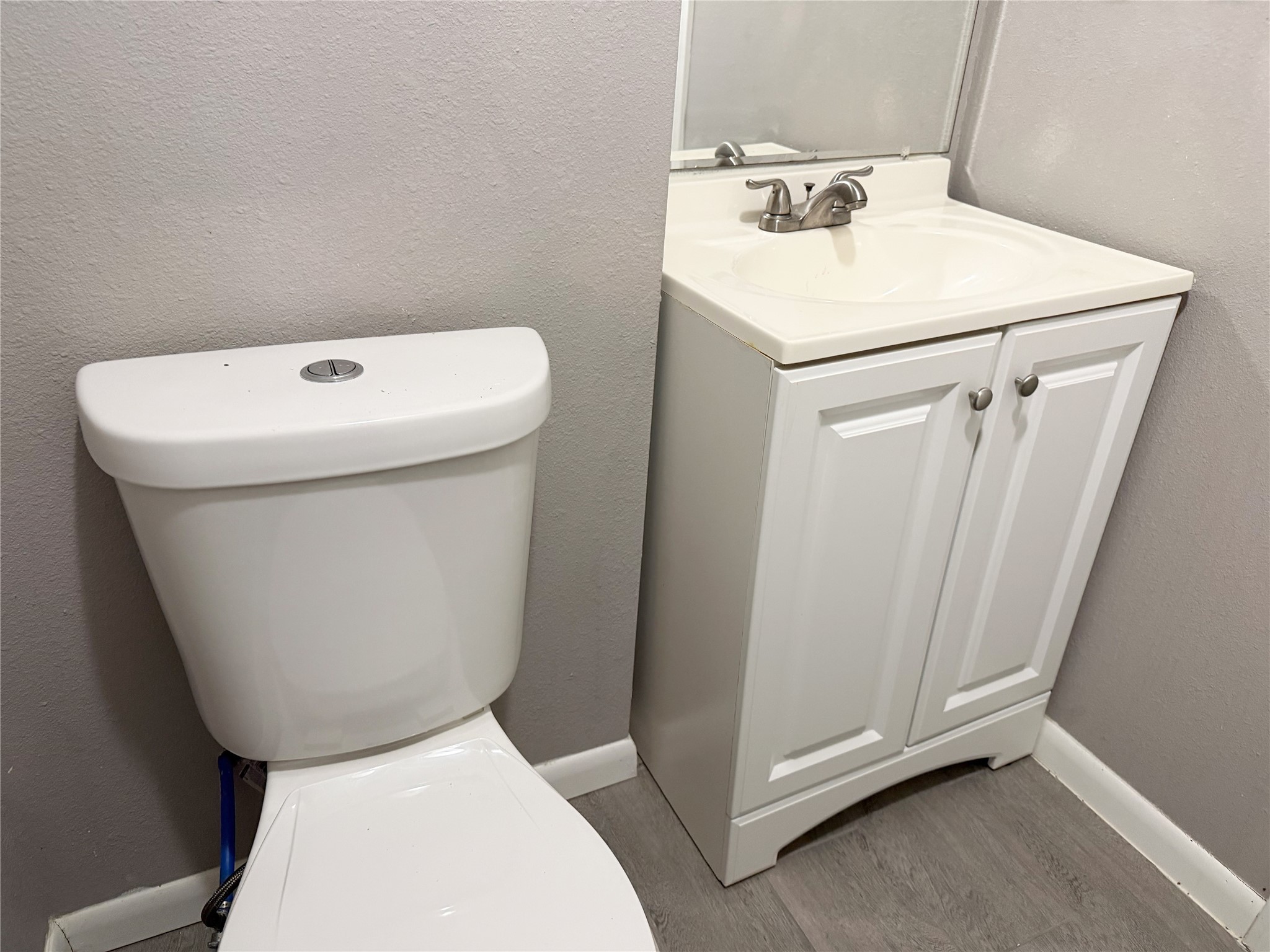 Half bath is conveniently located just off the bedroom, providing added functionality and privacy.