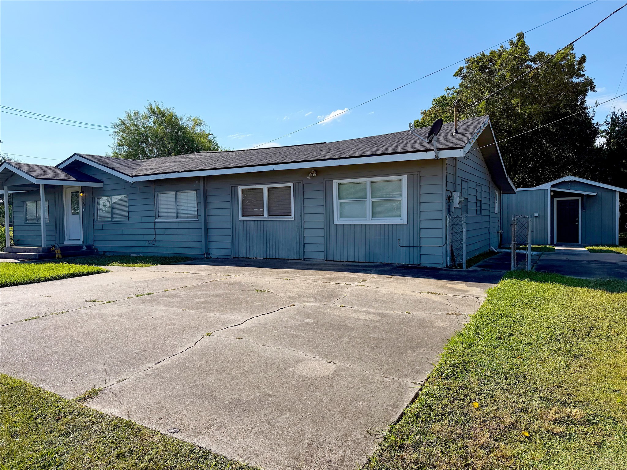 The front exterior offers a covered entry porch that adds a practical transition from the walkway to the front door.