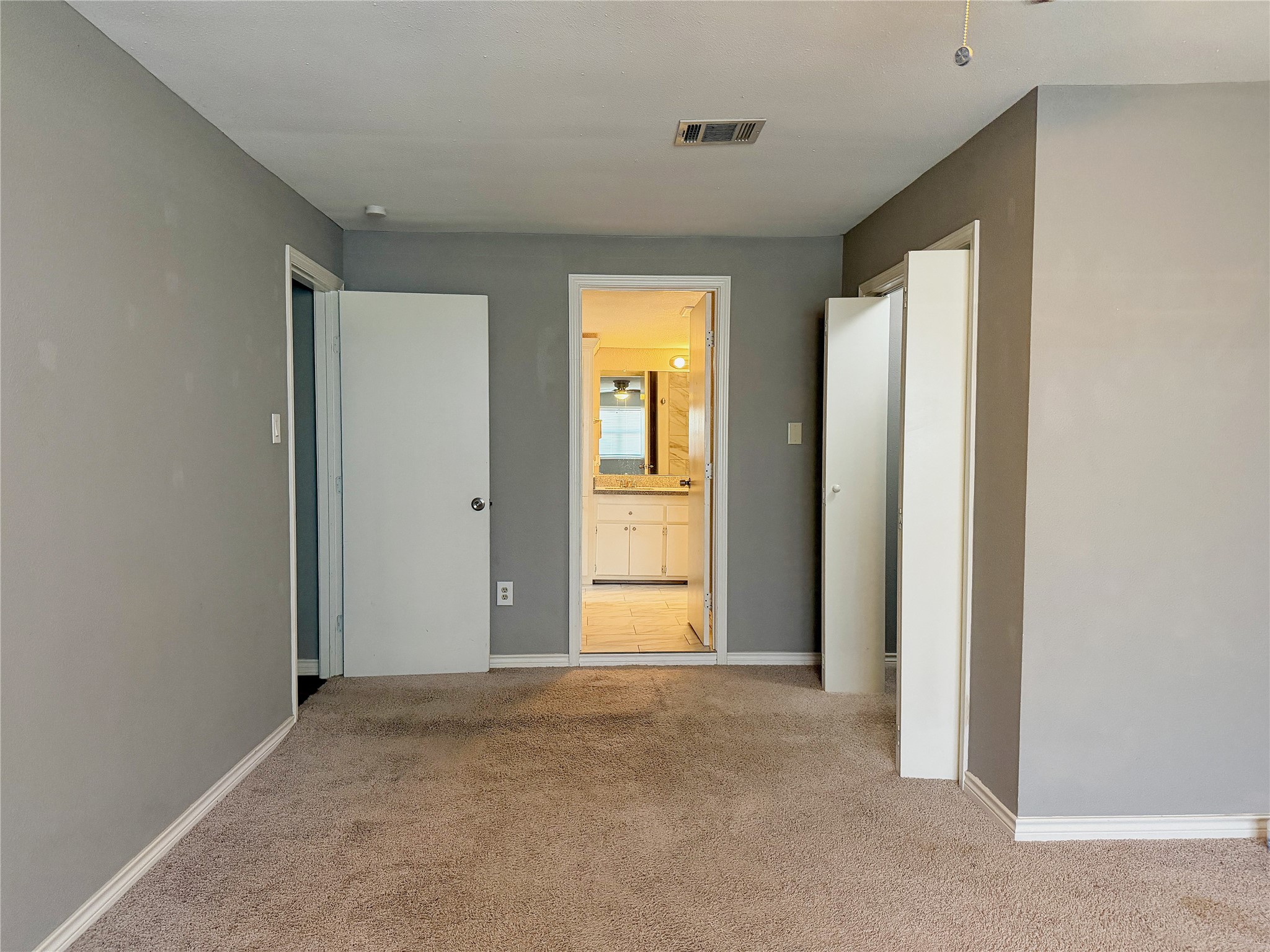 Primary bedroom offers direct access to the full bathroom for added convenience and privacy.