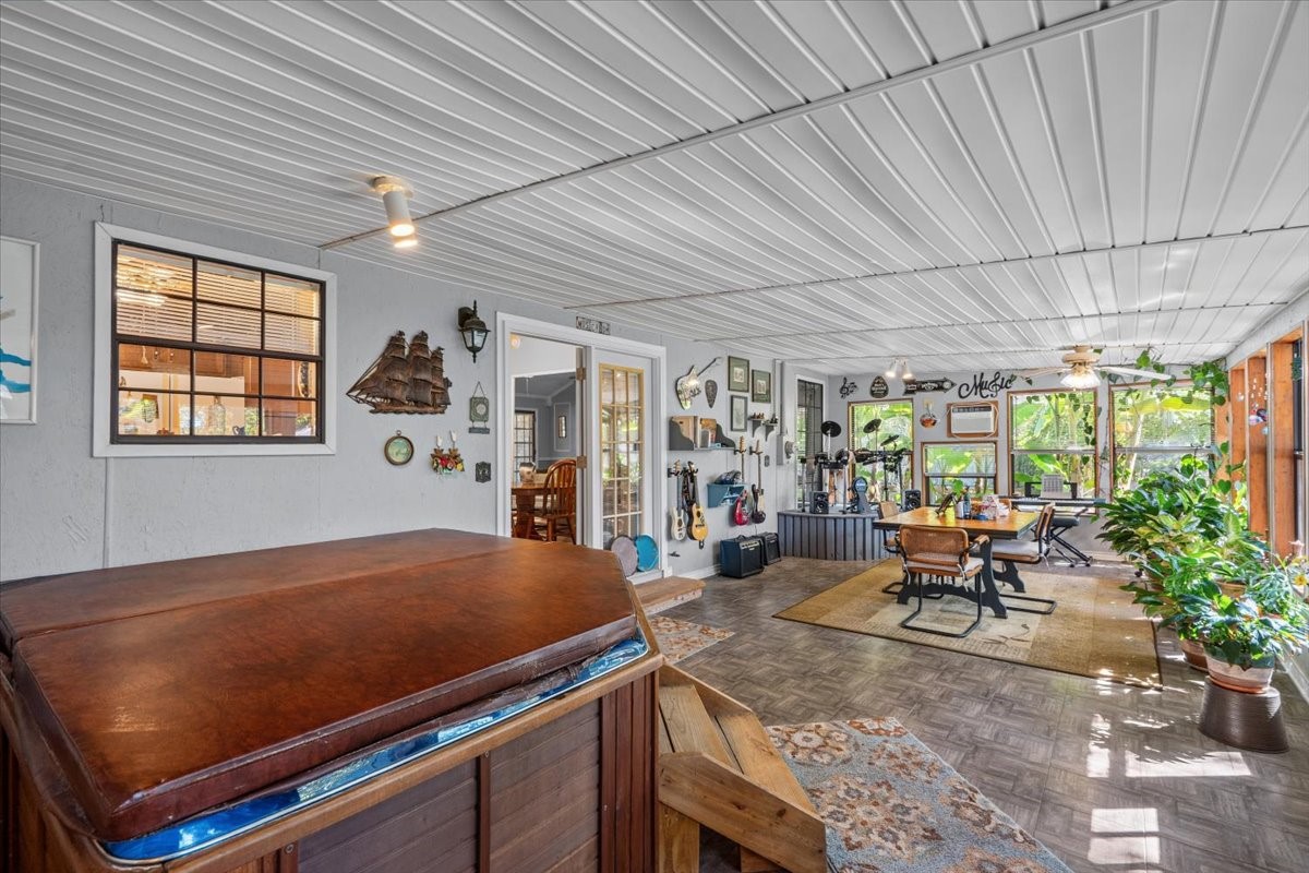 Screened in back patio with hot tub.