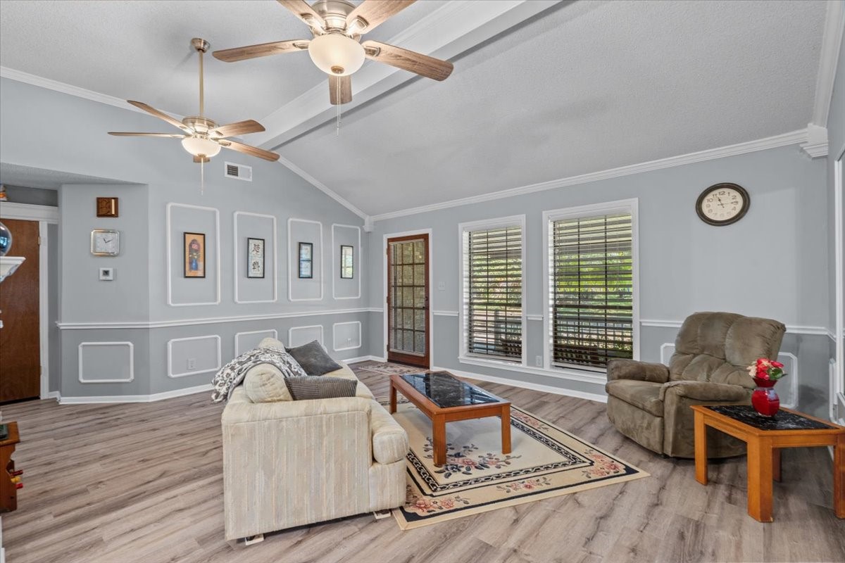 Living room with vinyl plank flooring.
